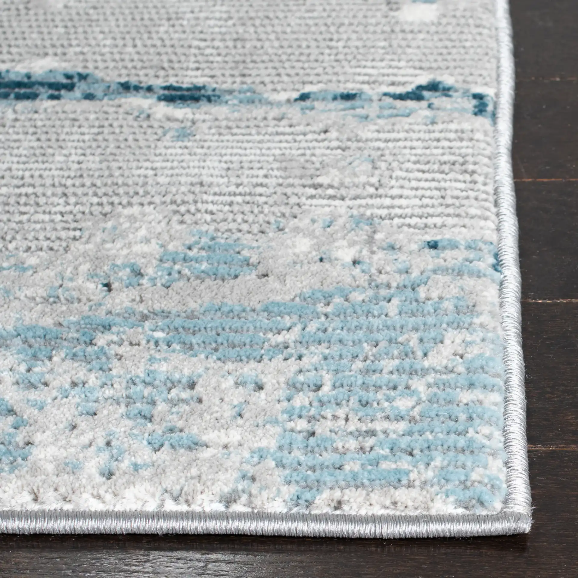 Meadow Abstract Landscape Rug in Light Gray / Blue in a styled room