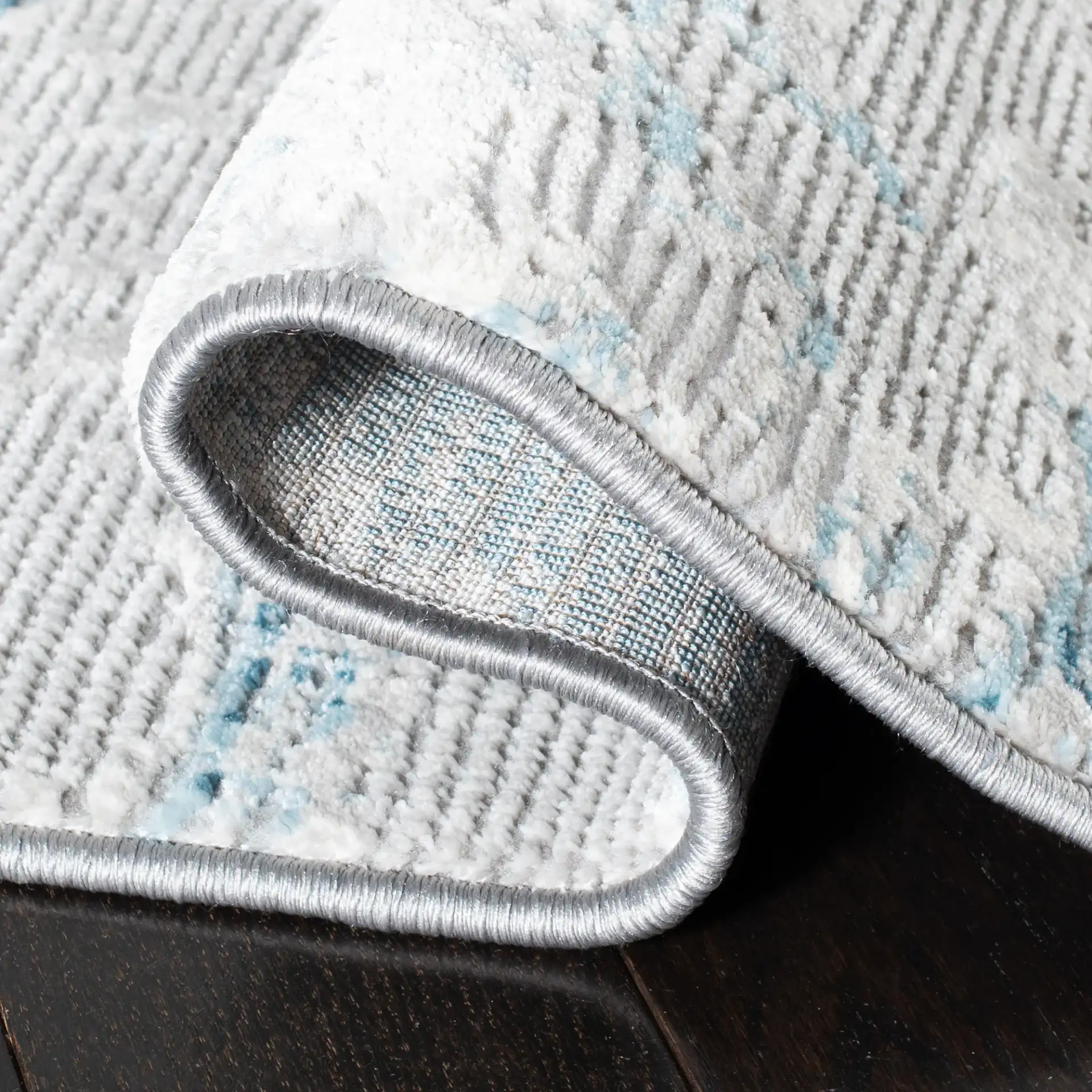 Meadow Abstract Landscape Rug in Light Gray / Blue in a styled room