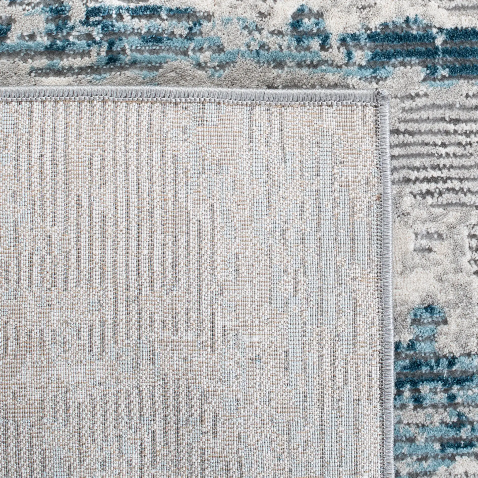 Meadow Abstract Landscape Rug in Light Gray / Blue in a styled room