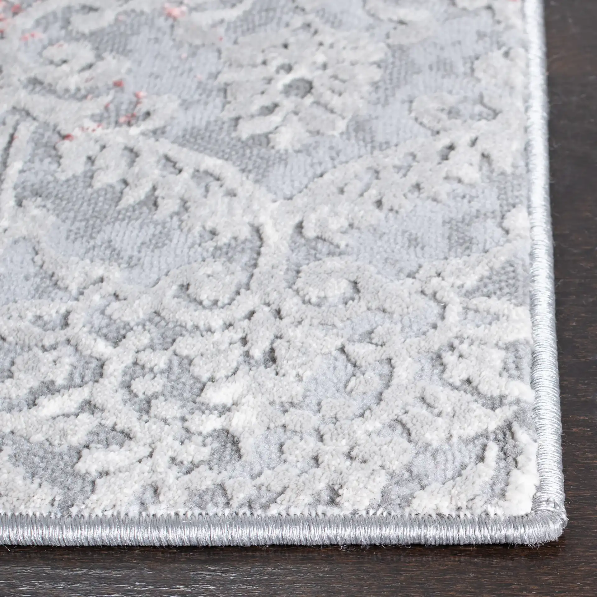 Meadow Distressed Damask Rug in Light Gray / Pink in a styled room