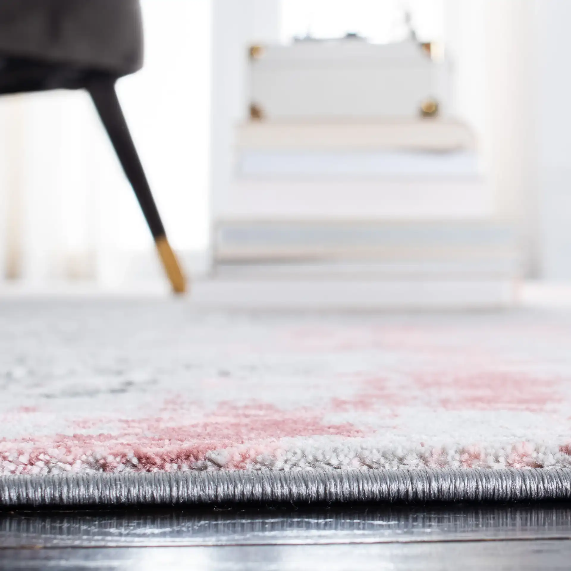Meadow Distressed Damask Rug in Light Gray / Pink in a styled room