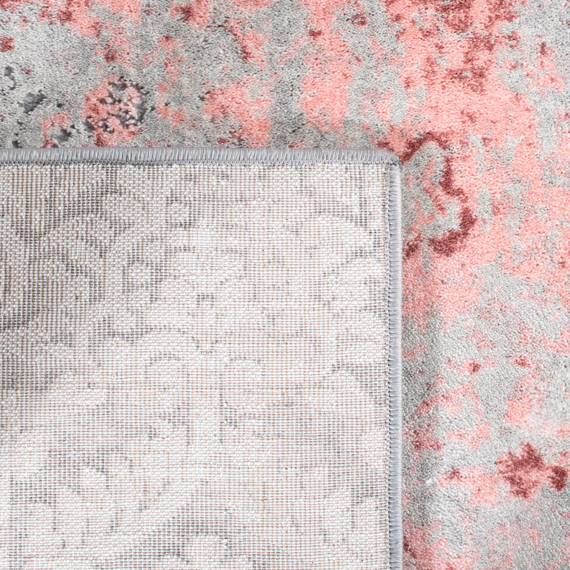 Meadow Distressed Damask Rug in Light Gray / Pink in a styled room