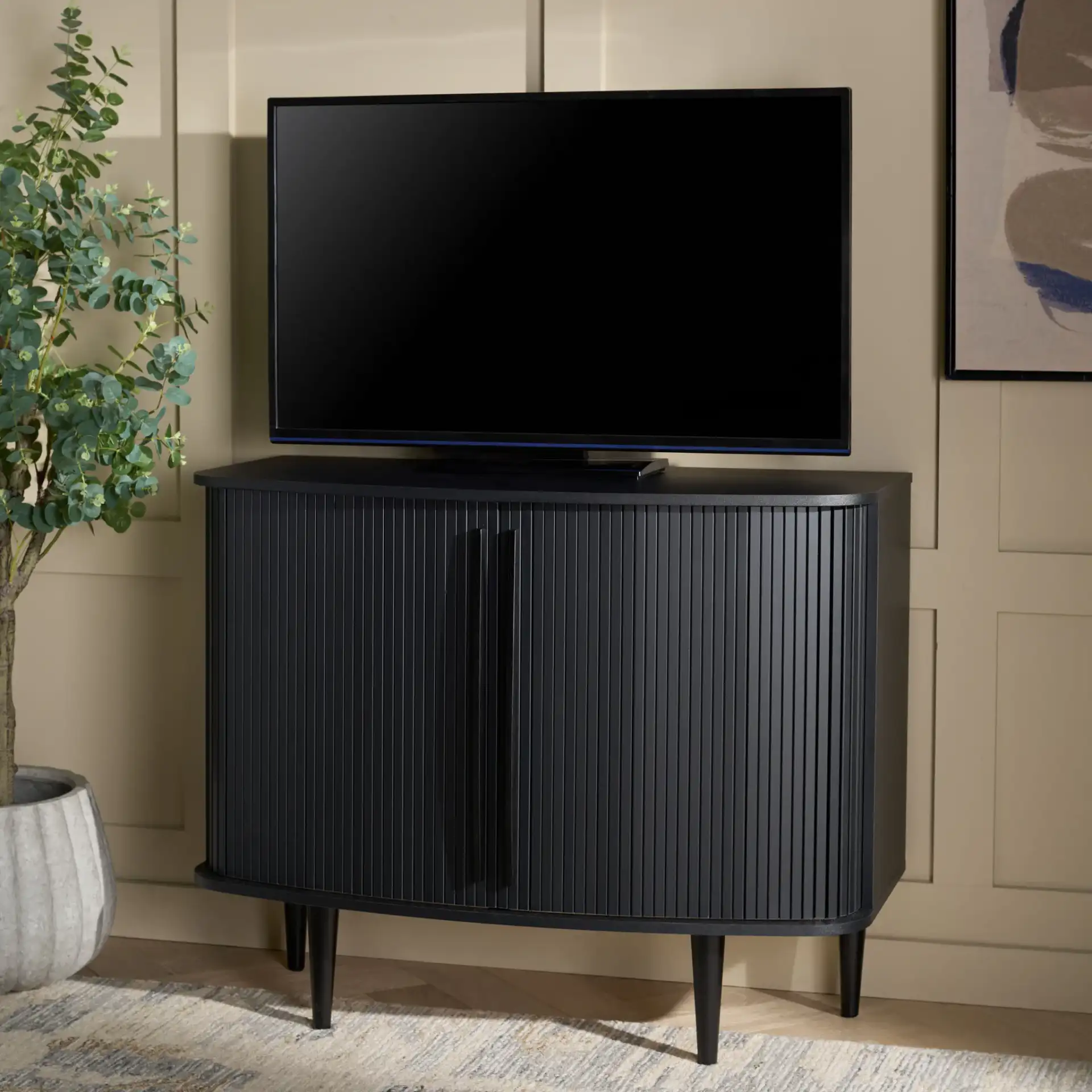 Sabby Tambour Door Compact Sideboard in Black in a styled room