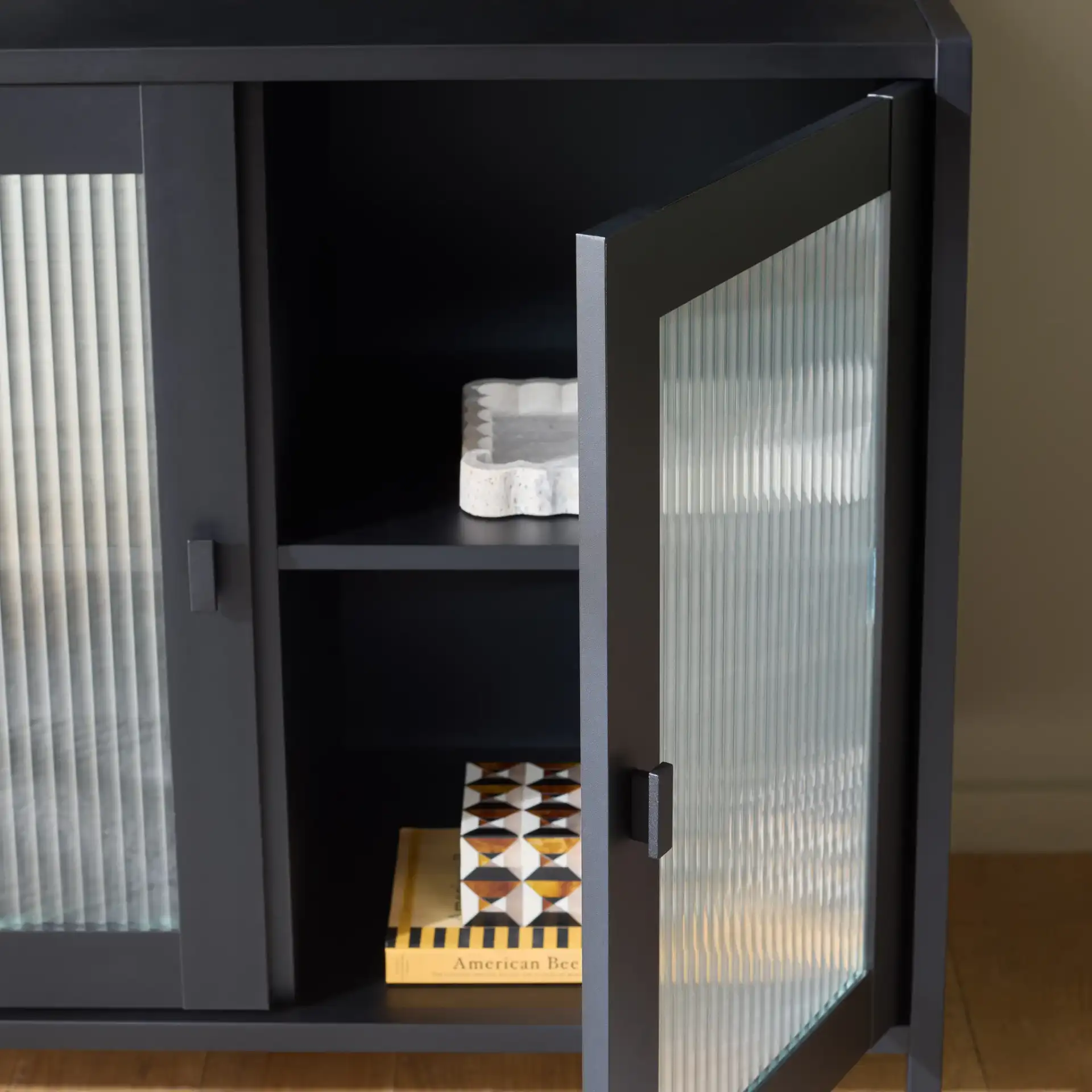 Donahue Sideboard/Media Stand in Black in a styled room