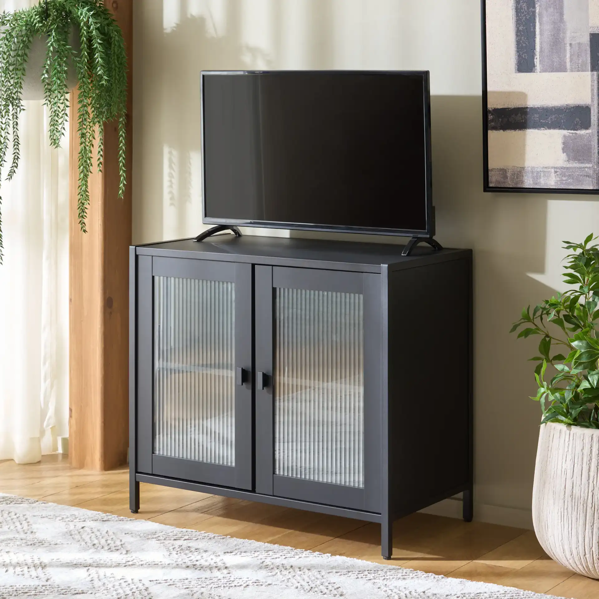 Donahue Sideboard/Media Stand in Black in a styled room