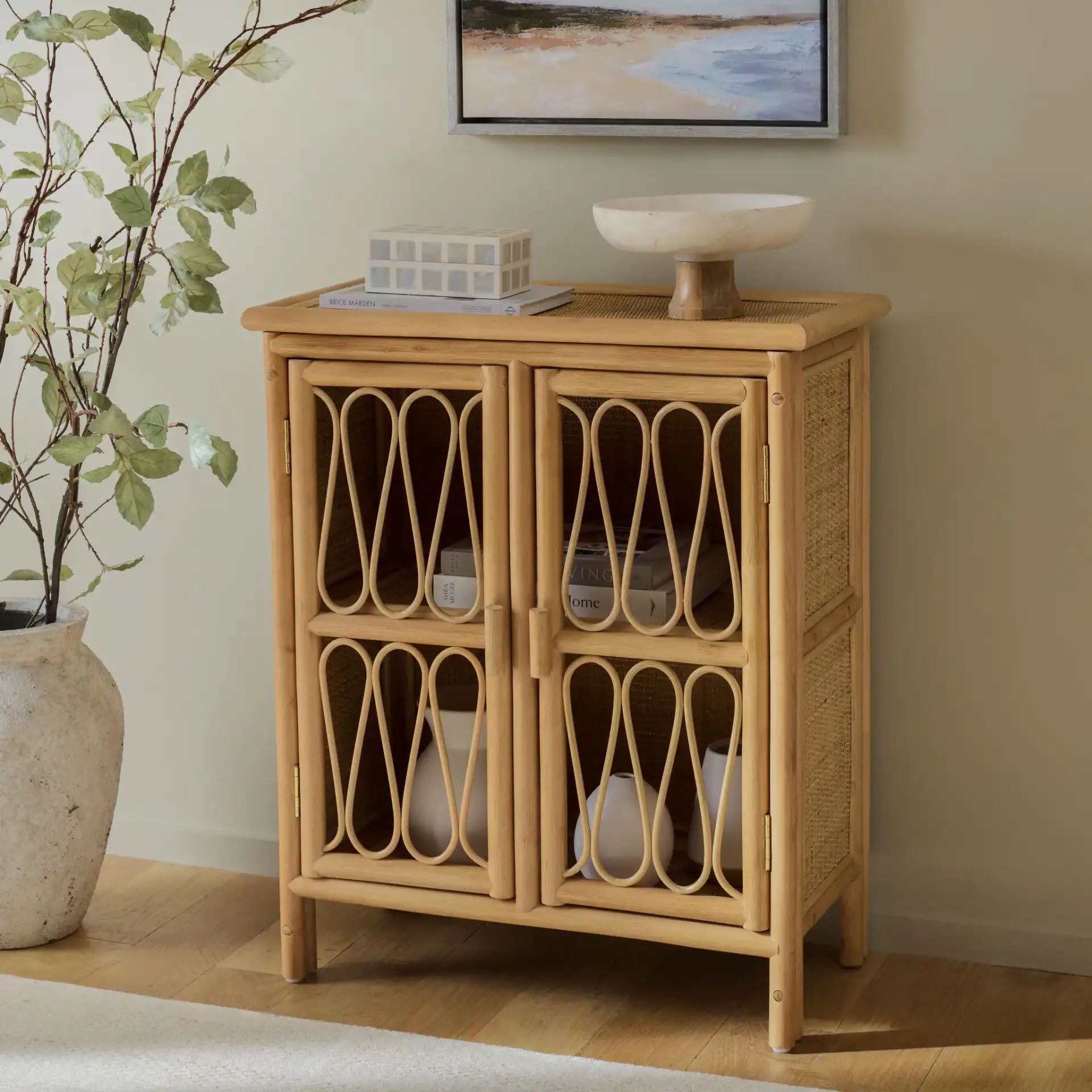 Evelina Rattan 2 Door Sideboard in Natural in a styled room