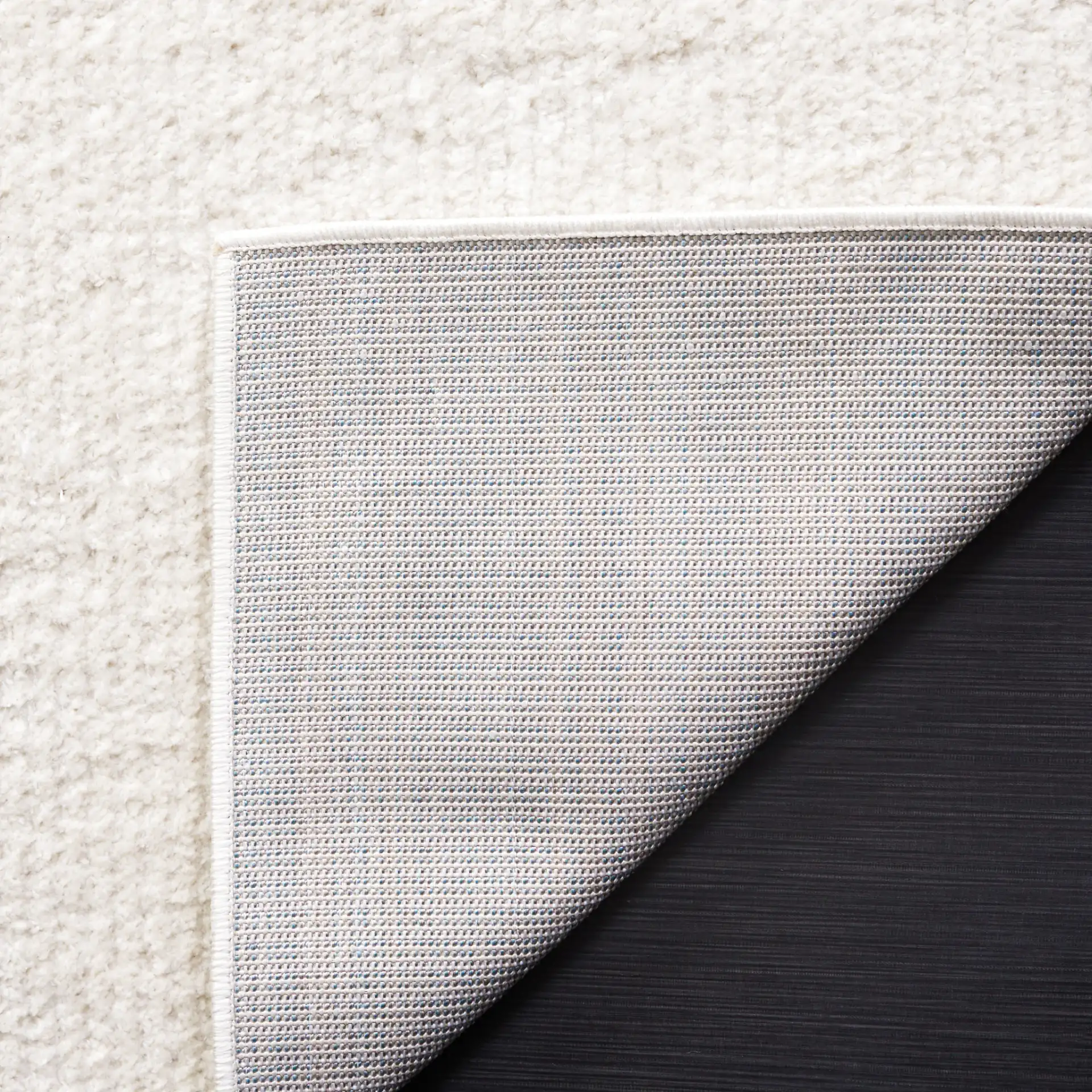Melody Ribbed Rug in Ivory in a styled room