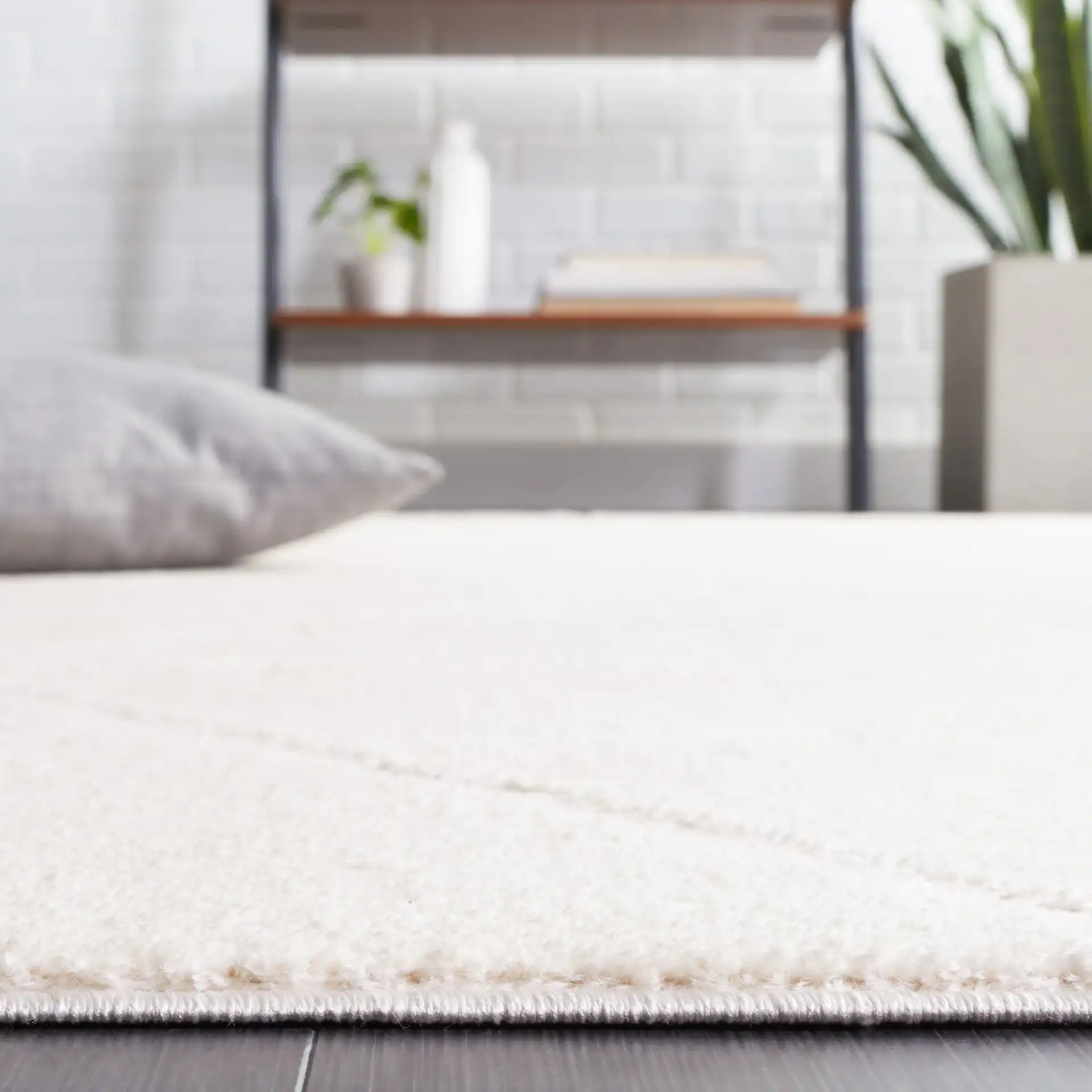 Melody Carved Diamond Rug in Ivory / Beige in a styled room