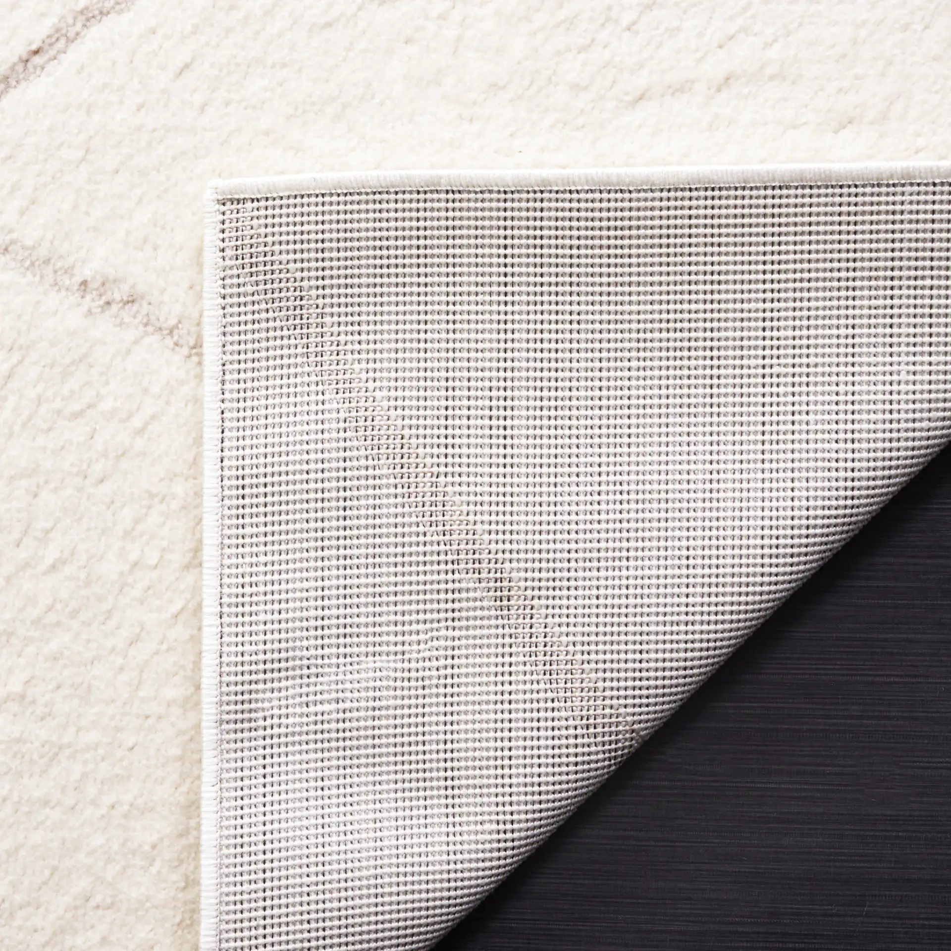 Melody Carved Diamond Rug in Ivory / Beige in a styled room