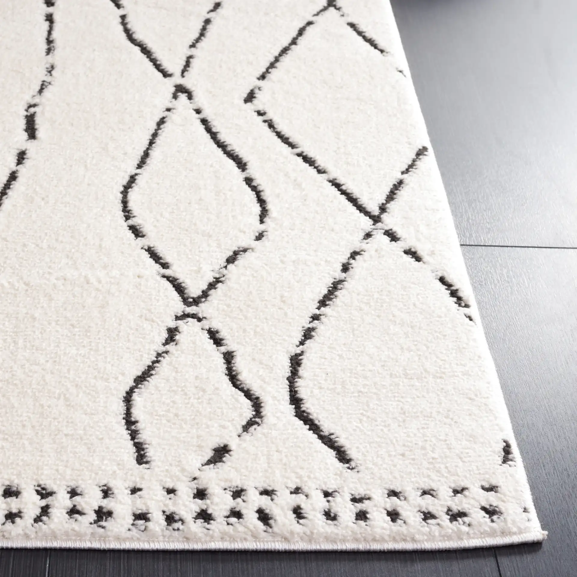 Melody Tulum Diamond Rug in Ivory / Black in a styled room