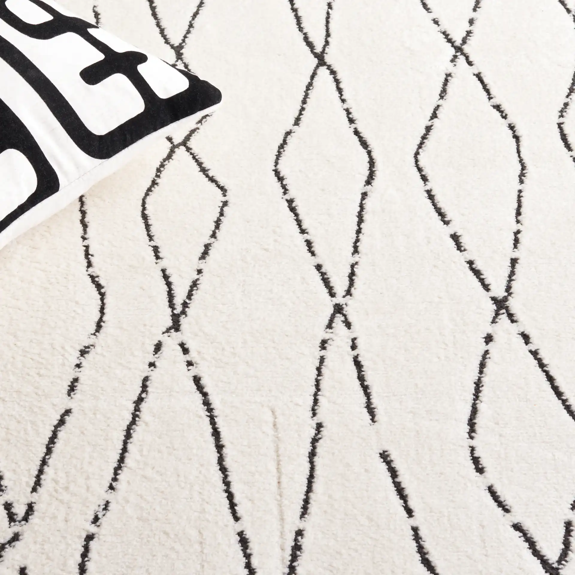 Melody Tulum Diamond Rug in Ivory / Black in a styled room