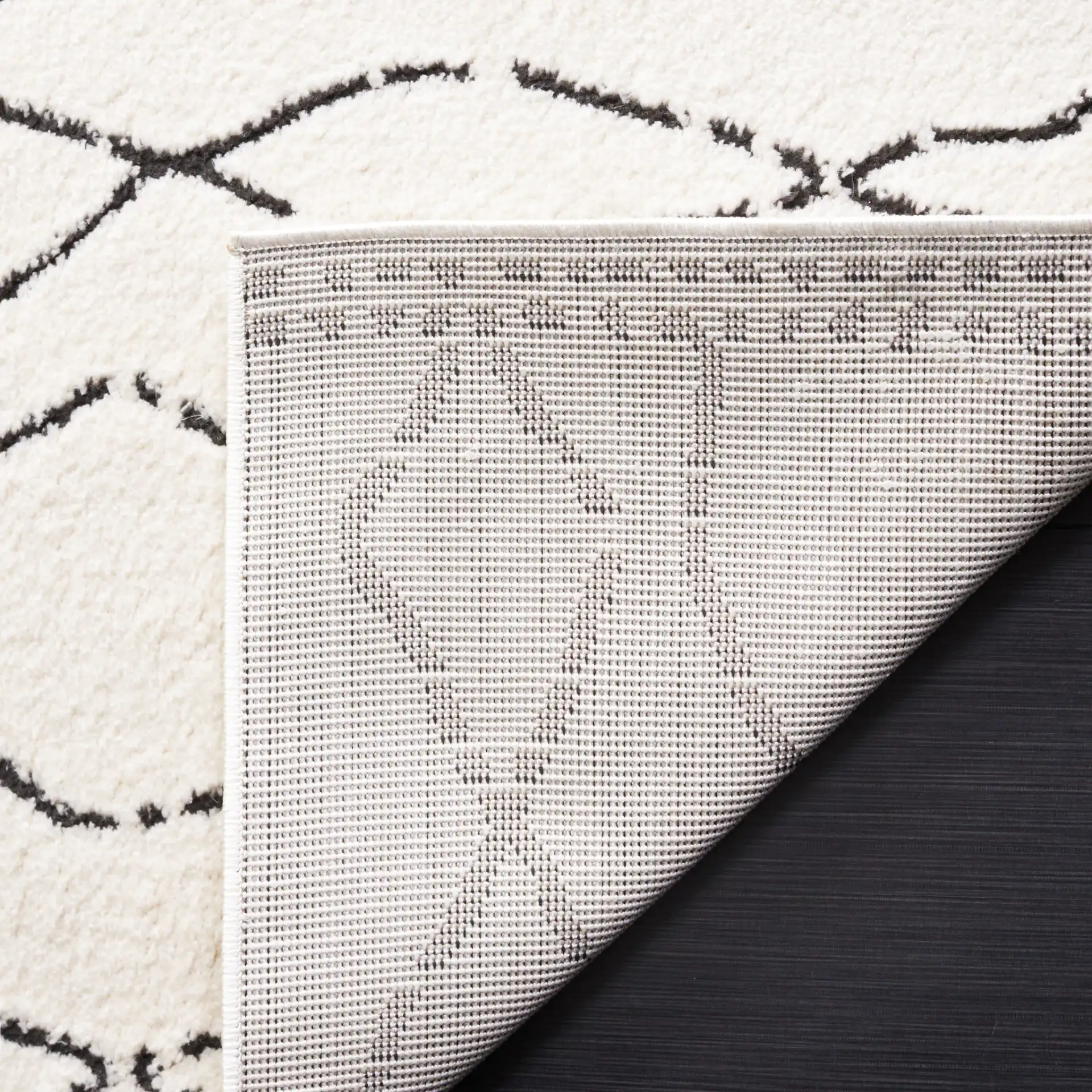 Melody Tulum Diamond Rug in Ivory / Black in a styled room