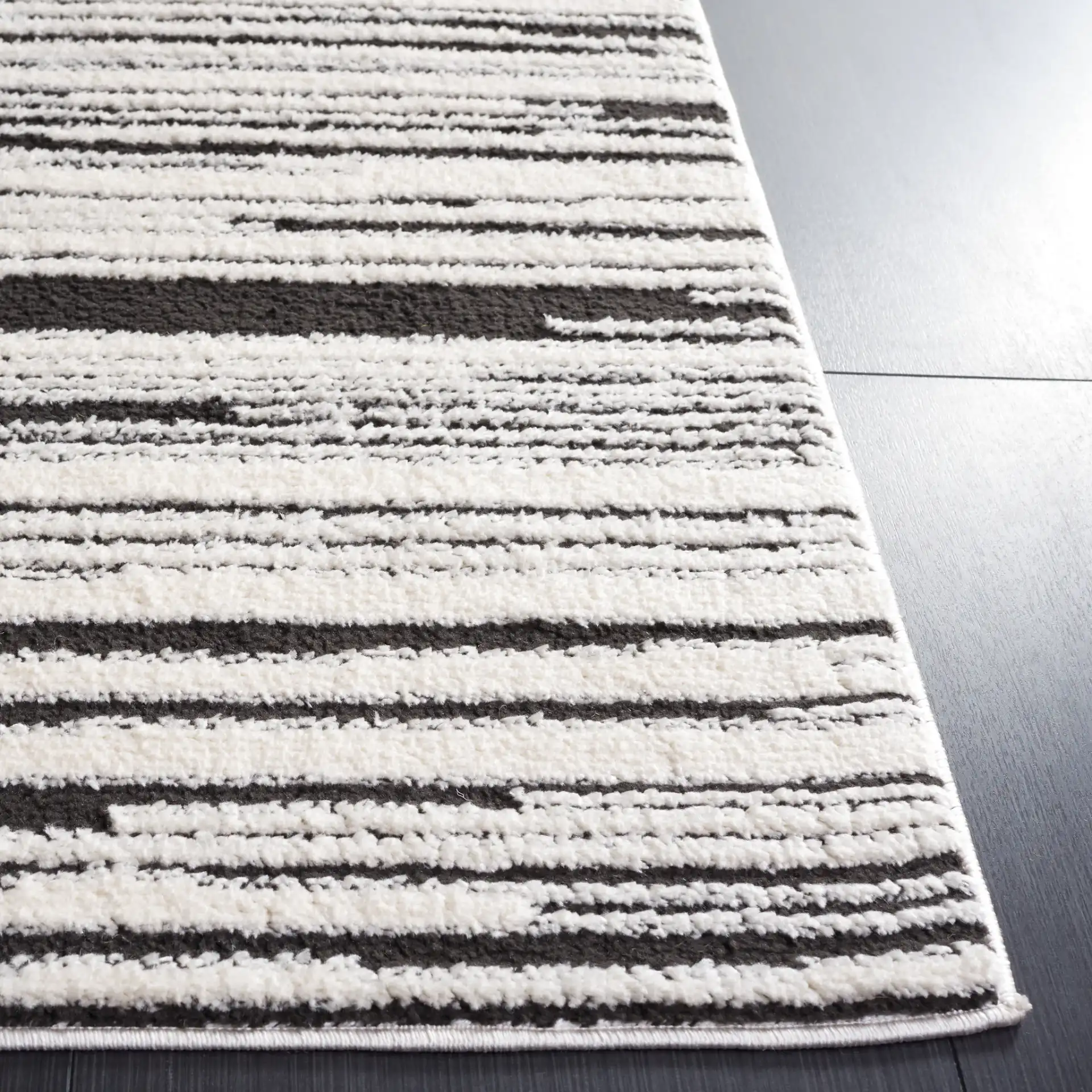 Melody Modern Linear Stripe Rug in Ivory / Black in a styled room