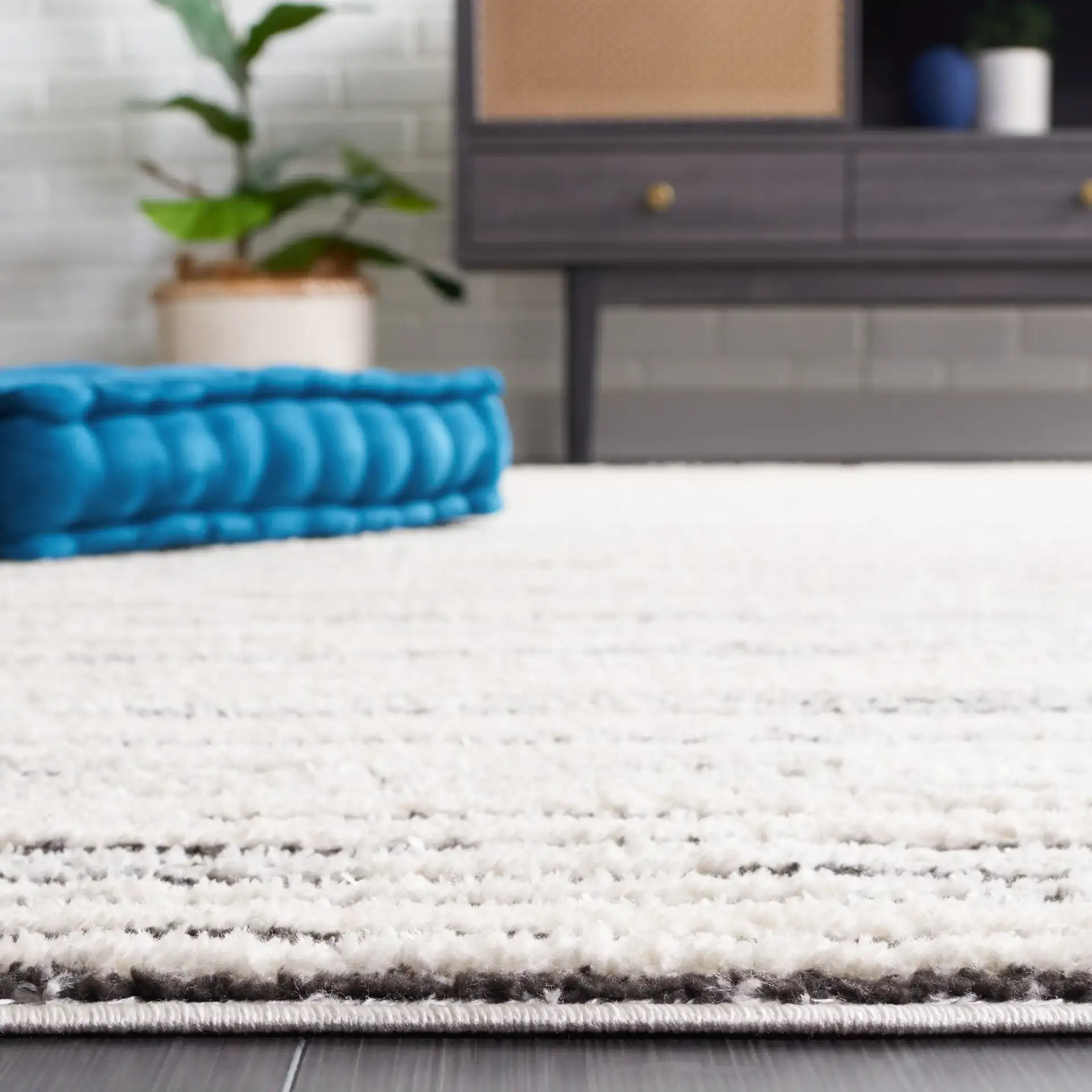 Melody Modern Linear Stripe Rug in Ivory / Black in a styled room