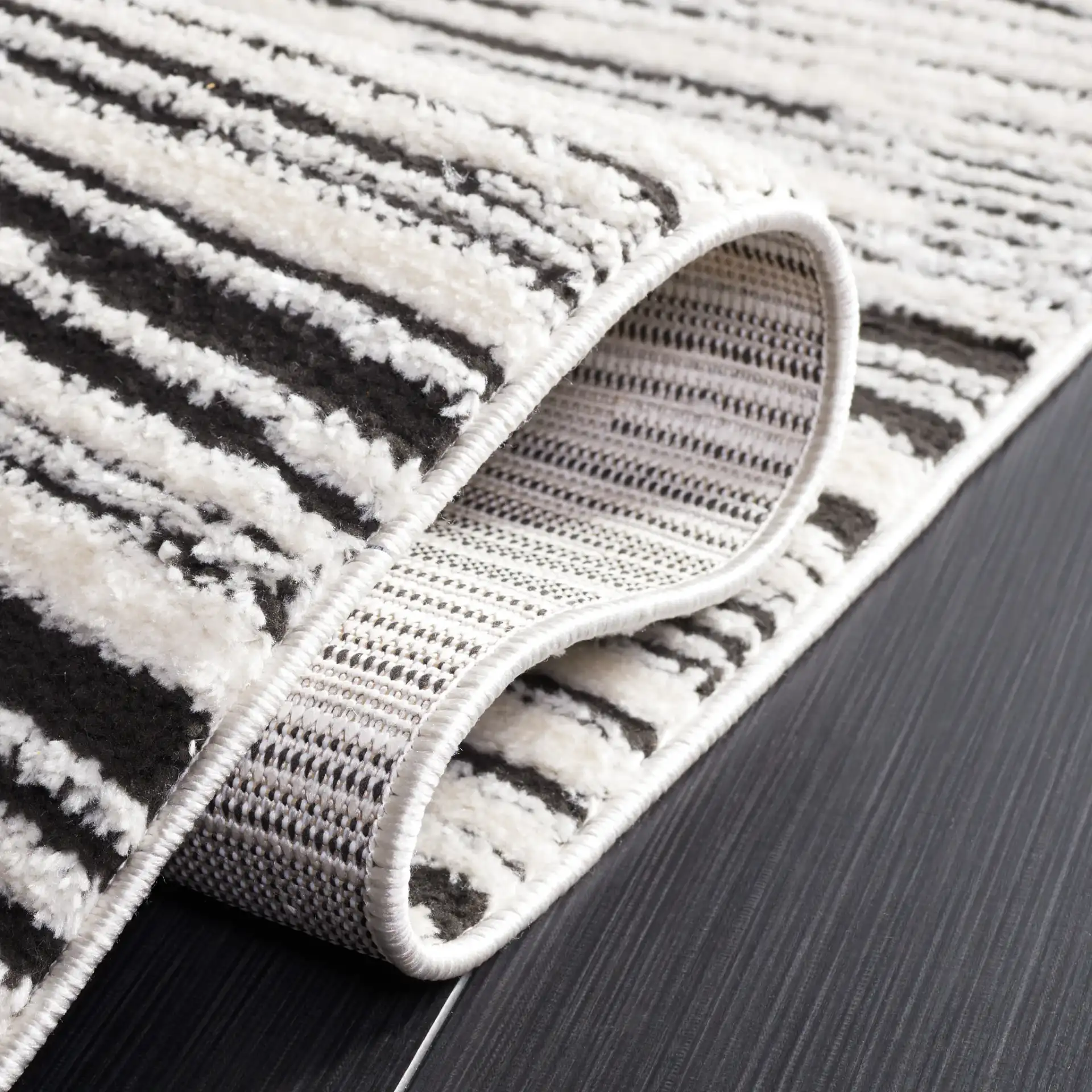 Melody Modern Linear Stripe Rug in Ivory / Black in a styled room