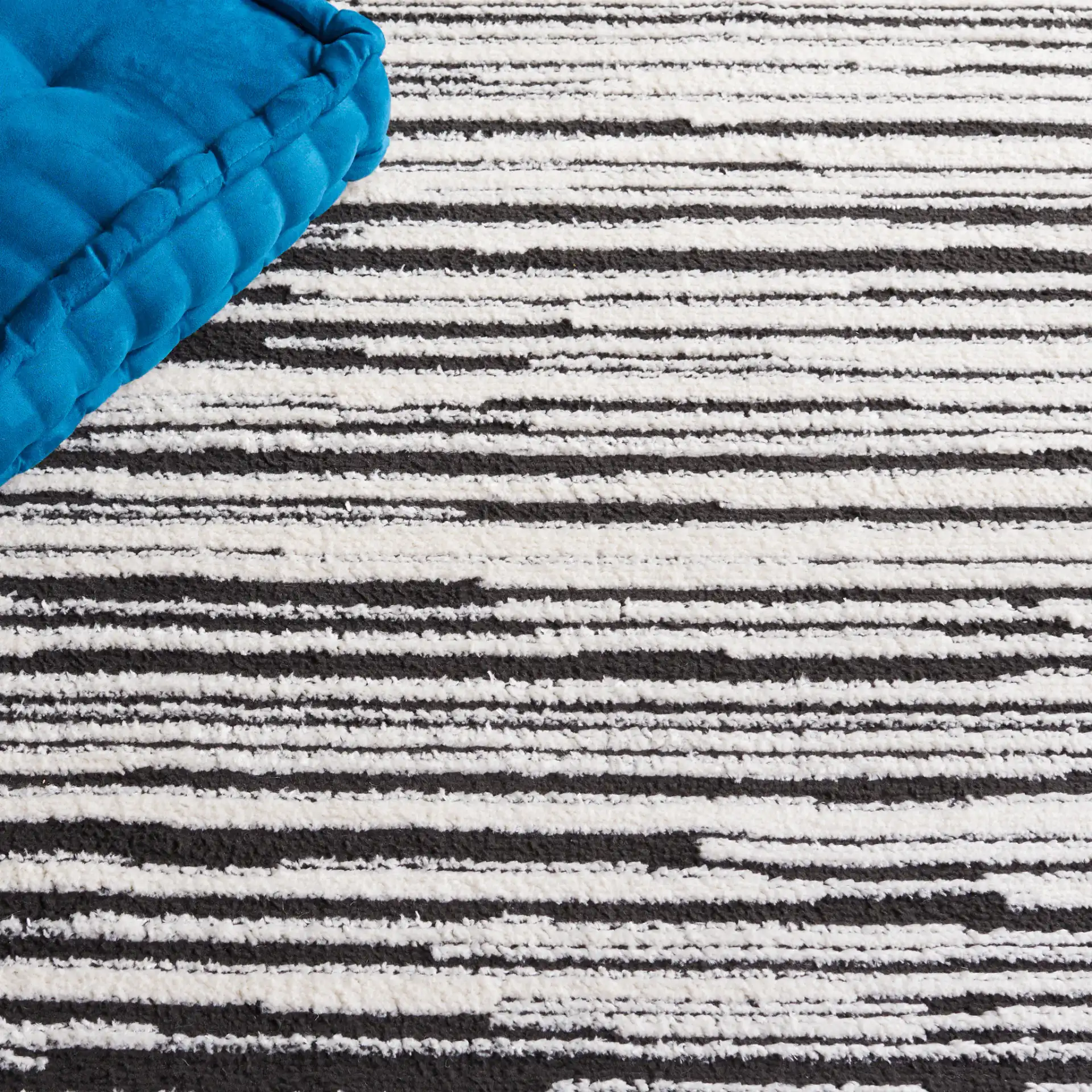 Melody Modern Linear Stripe Rug in Ivory / Black in a styled room