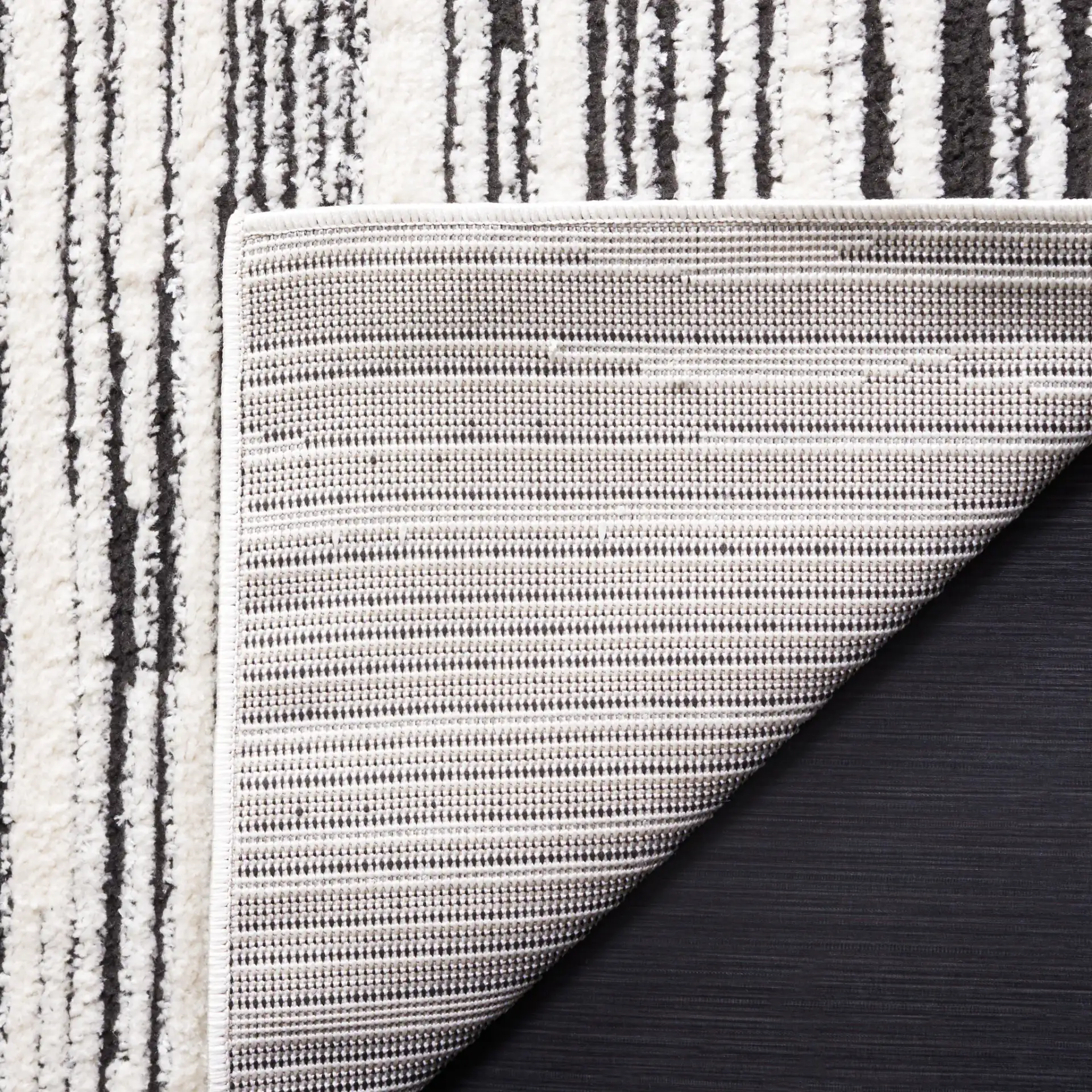 Melody Modern Linear Stripe Rug in Ivory / Black in a styled room