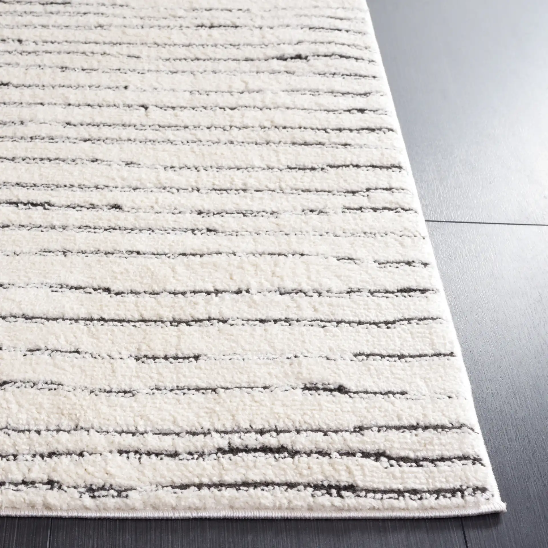 Melody Broken Stripe Rug in Ivory / Black in a styled room