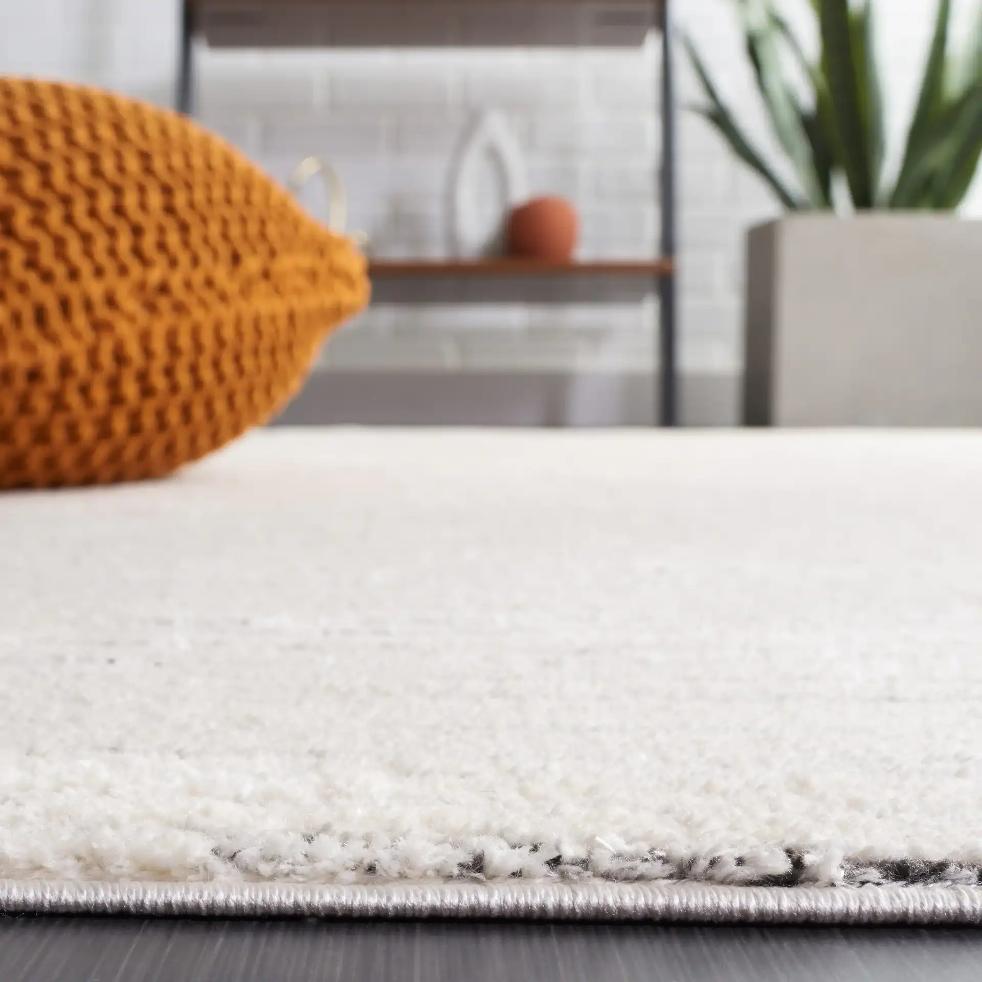 Melody Broken Stripe Rug in Ivory / Black in a styled room