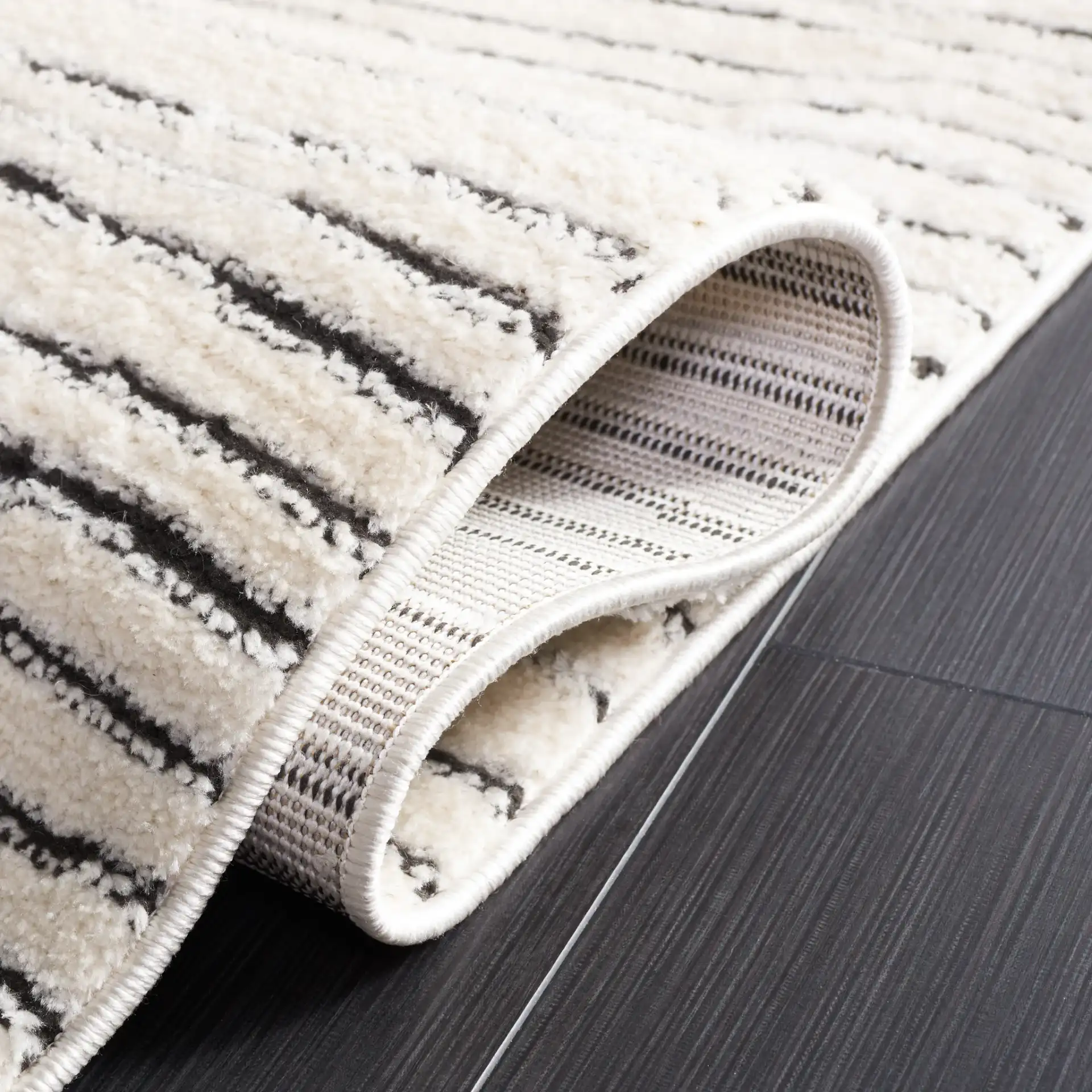 Melody Broken Stripe Rug in Ivory / Black in a styled room