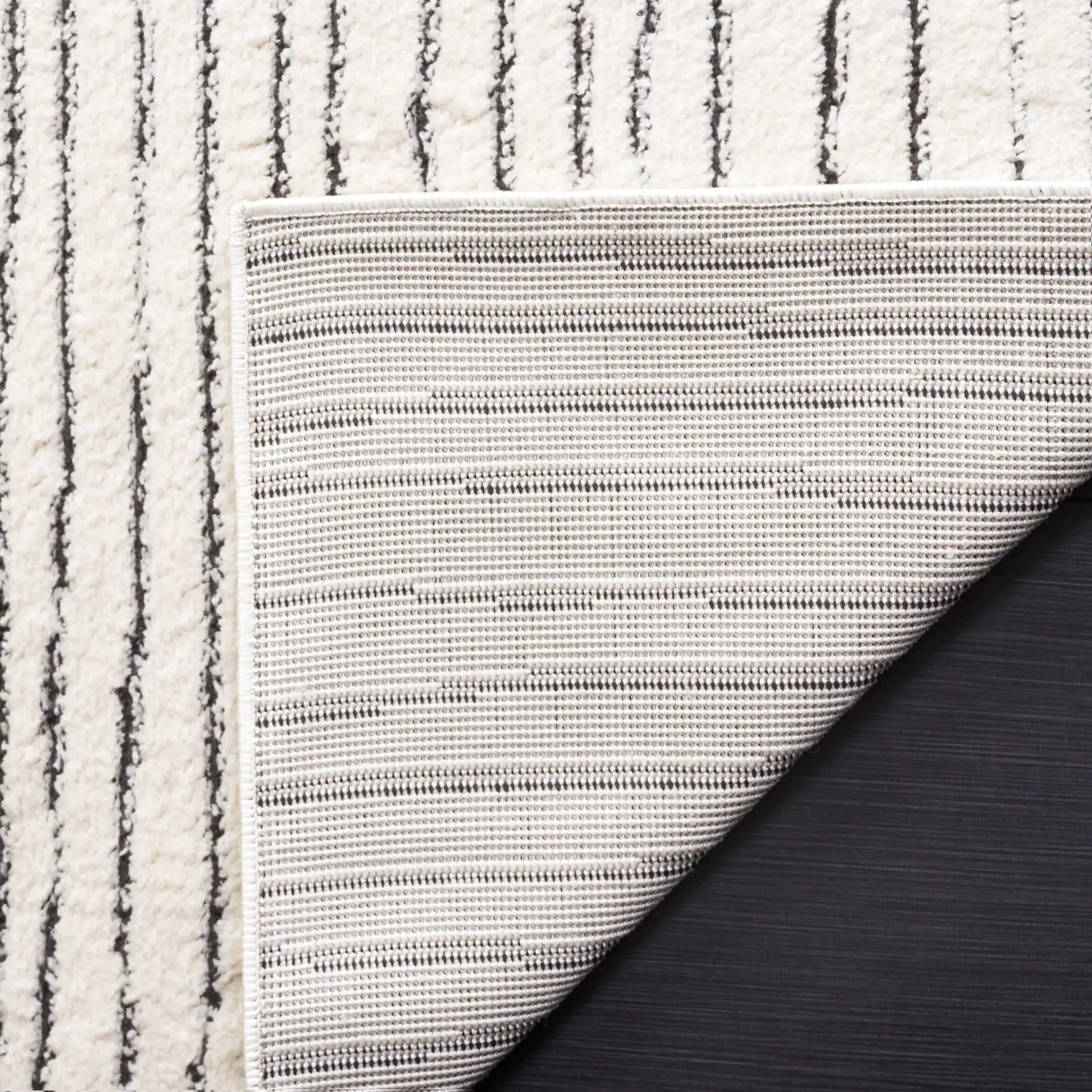 Melody Broken Stripe Rug in Ivory / Black in a styled room