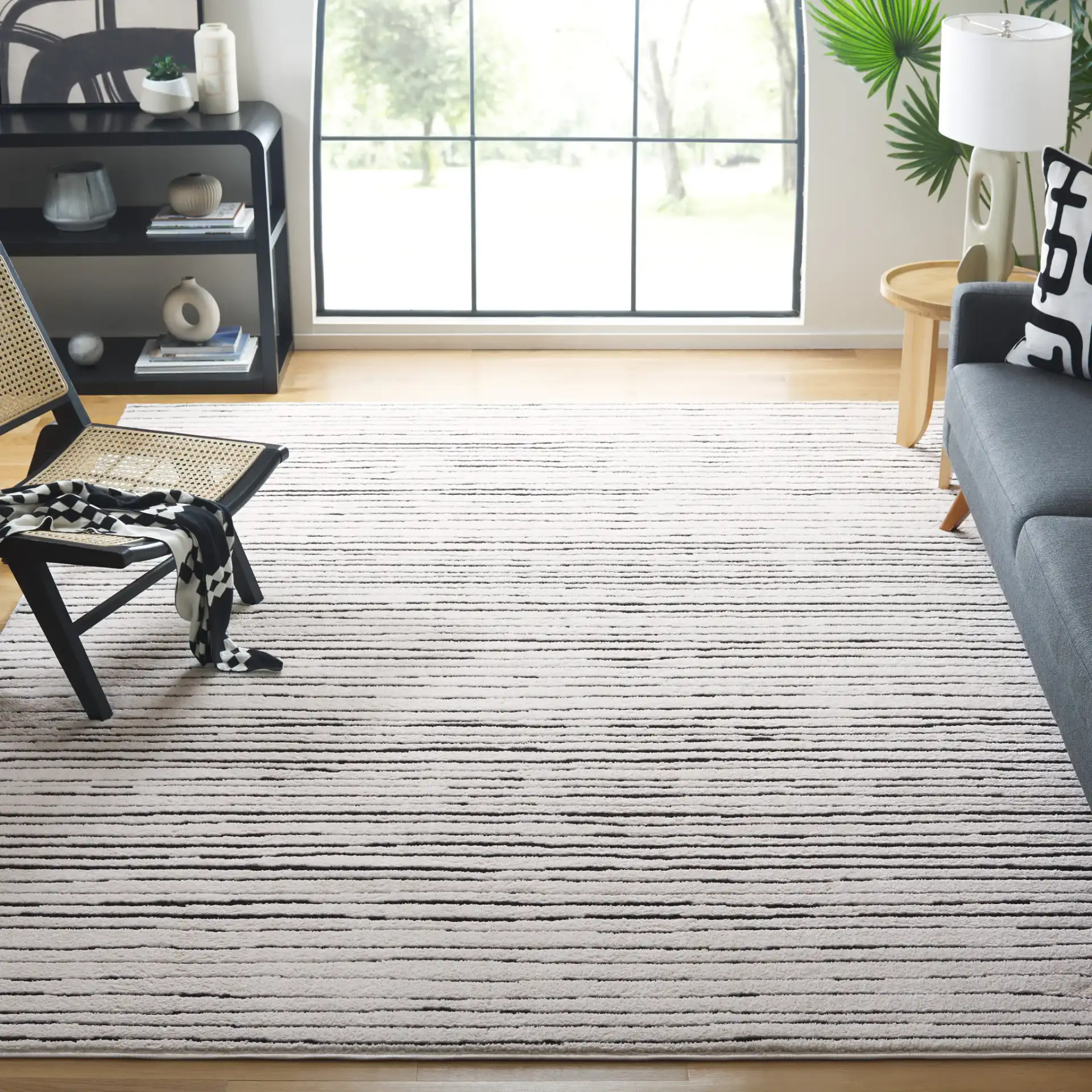 Melody Broken Stripe Rug in Ivory / Black in a styled room