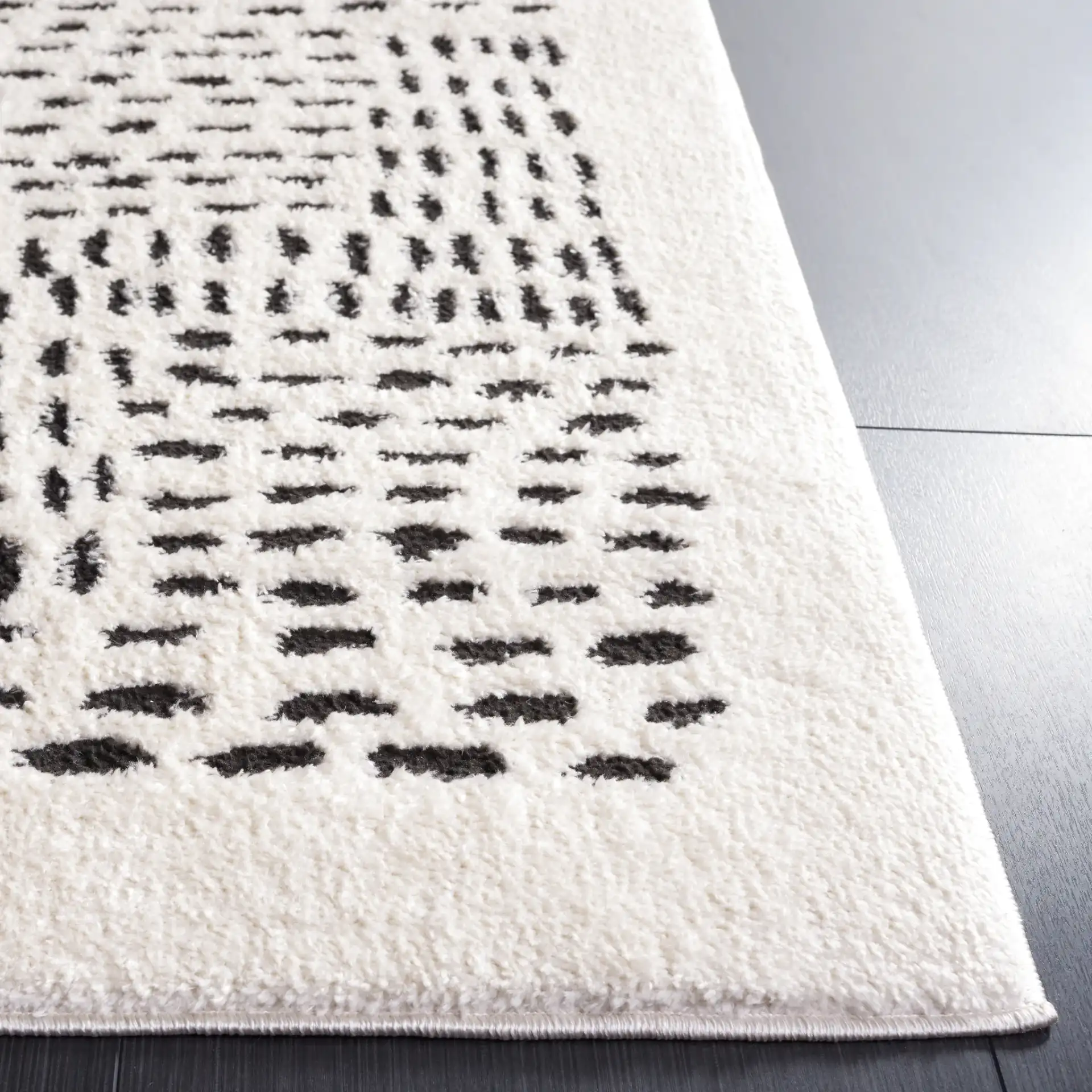 Melody Dashed Block Rug in Ivory / Black in a styled room