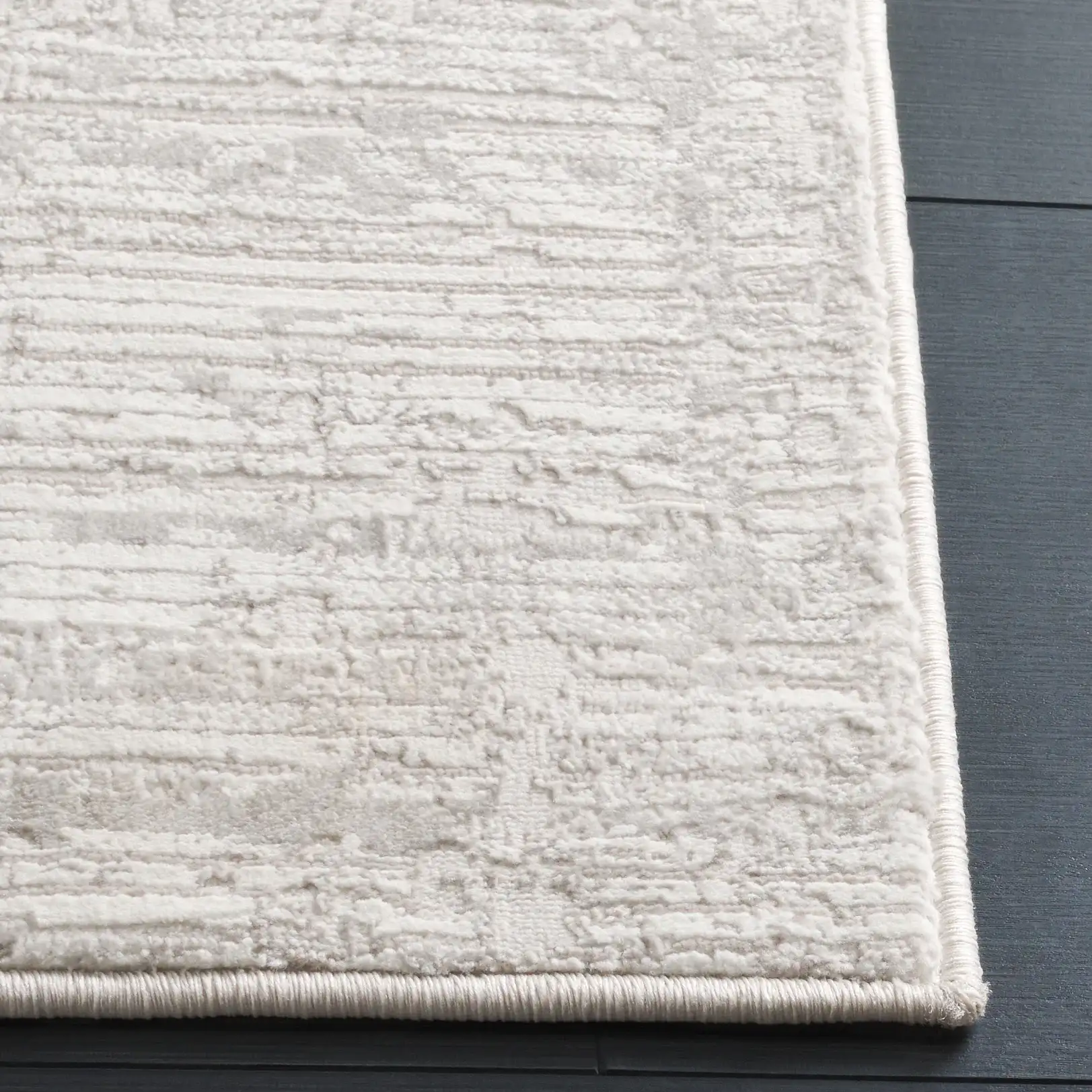 Memphis Distressed Linear Rug in Gray / Ivory in a styled room