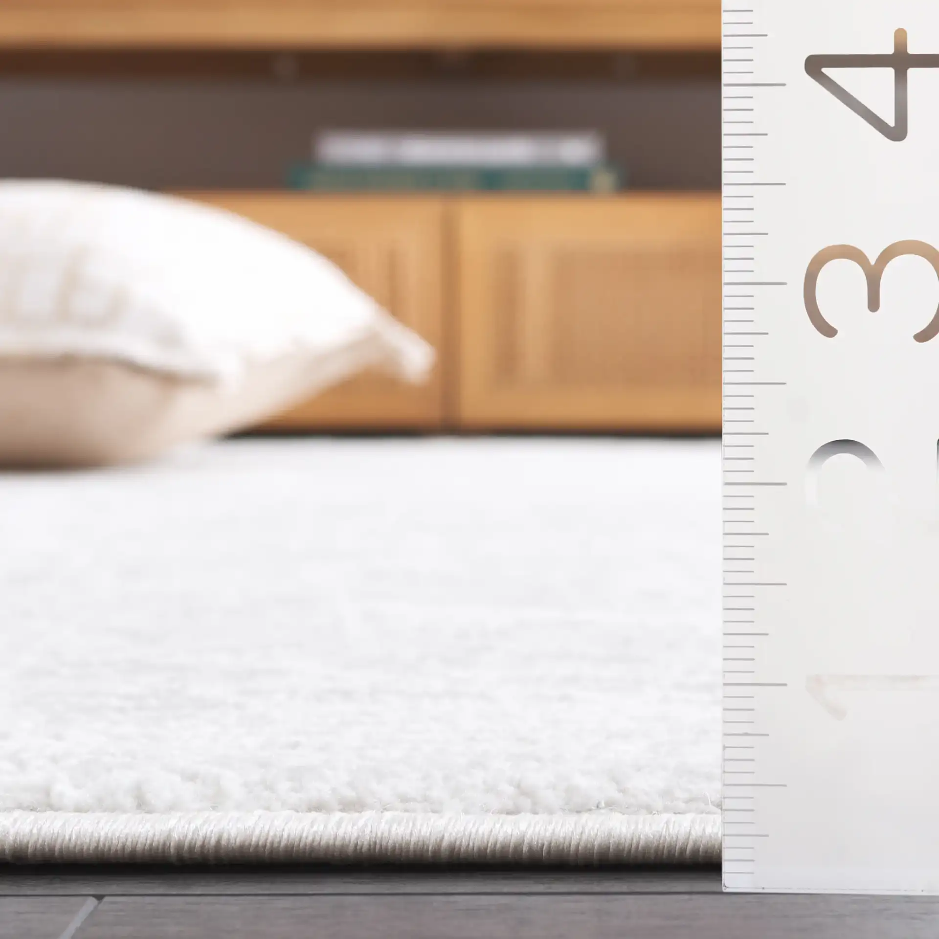 Memphis Abstract Web Rug in Gray / Ivory in a styled room