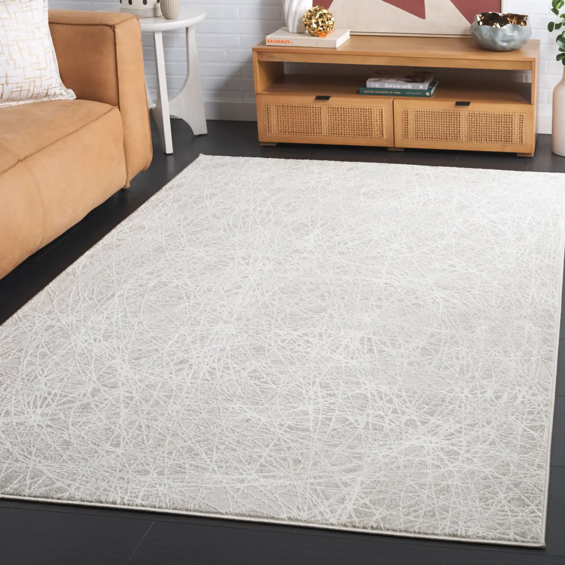 Memphis Abstract Web Rug in Gray / Ivory in a styled room