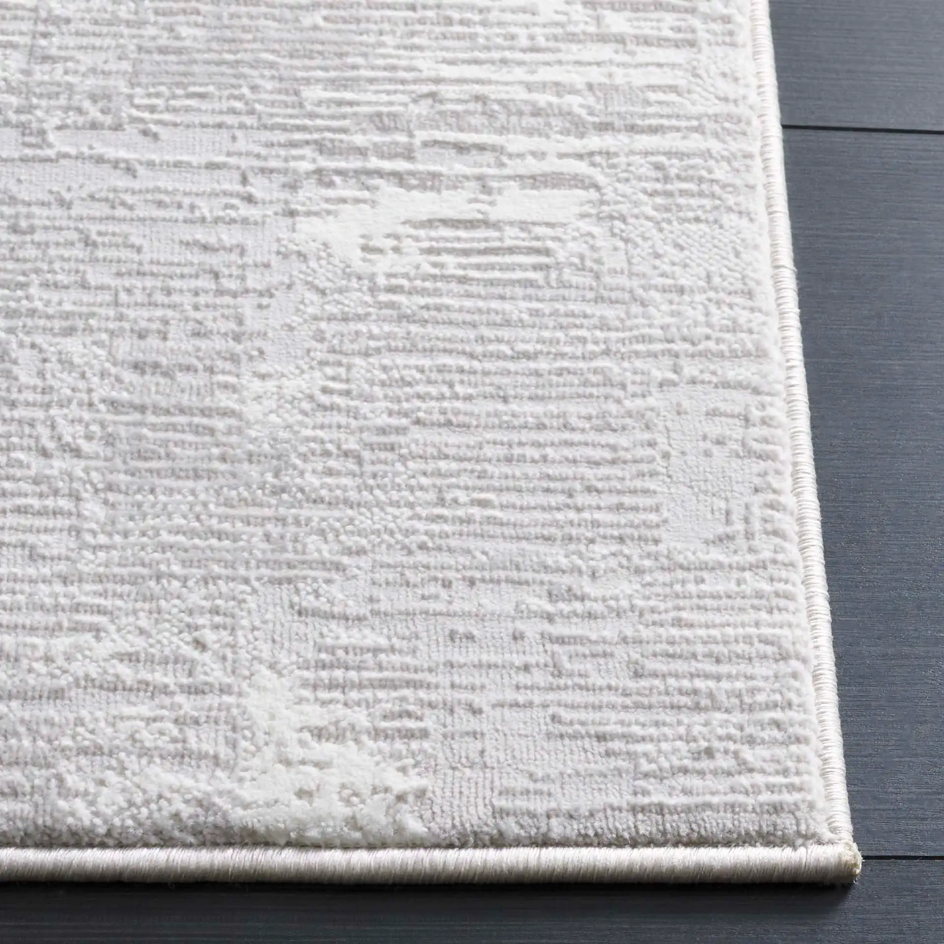 Memphis Distressed Abstract Rug in Gray / Ivory in a styled room