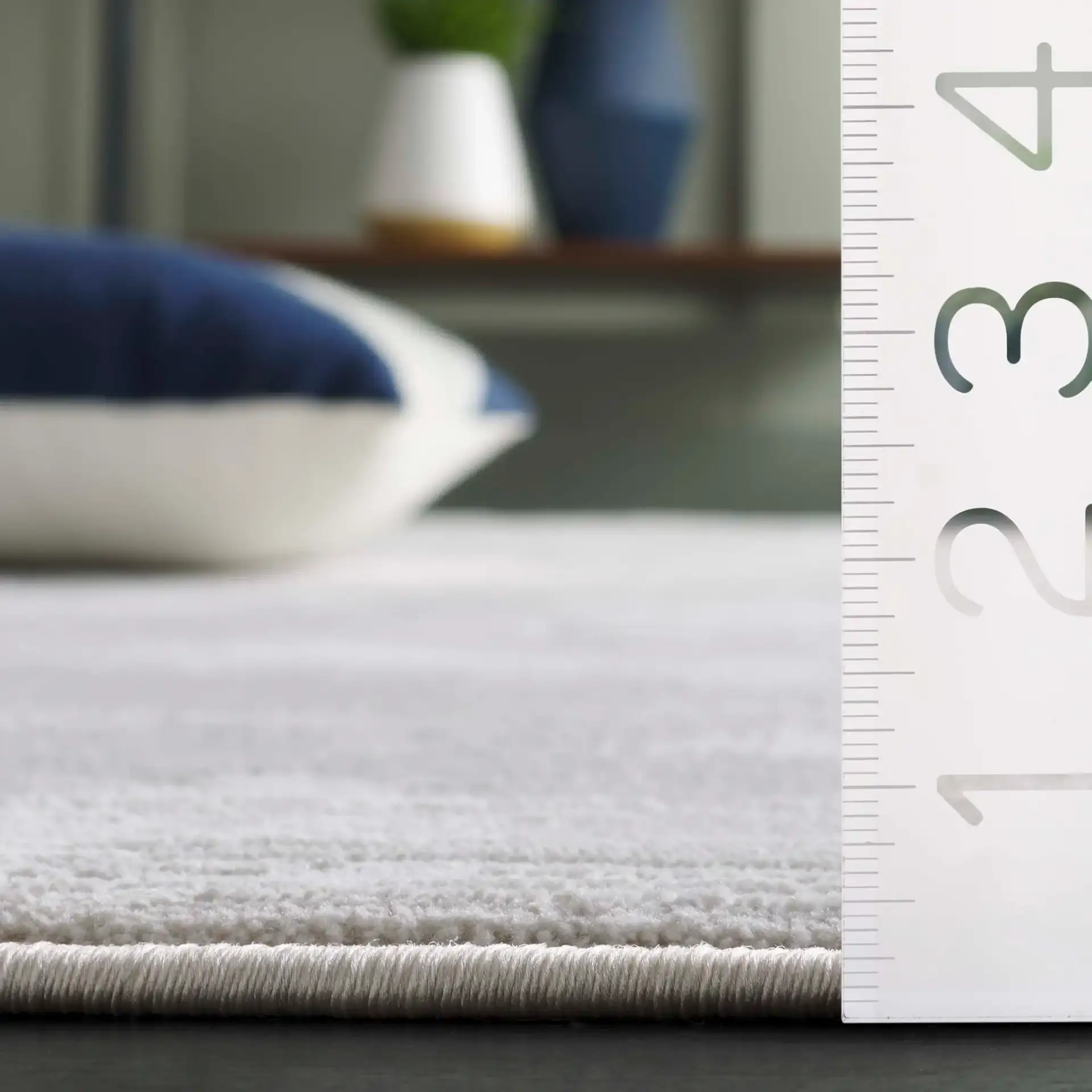 Memphis Distressed Abstract Rug in Gray / Ivory in a styled room