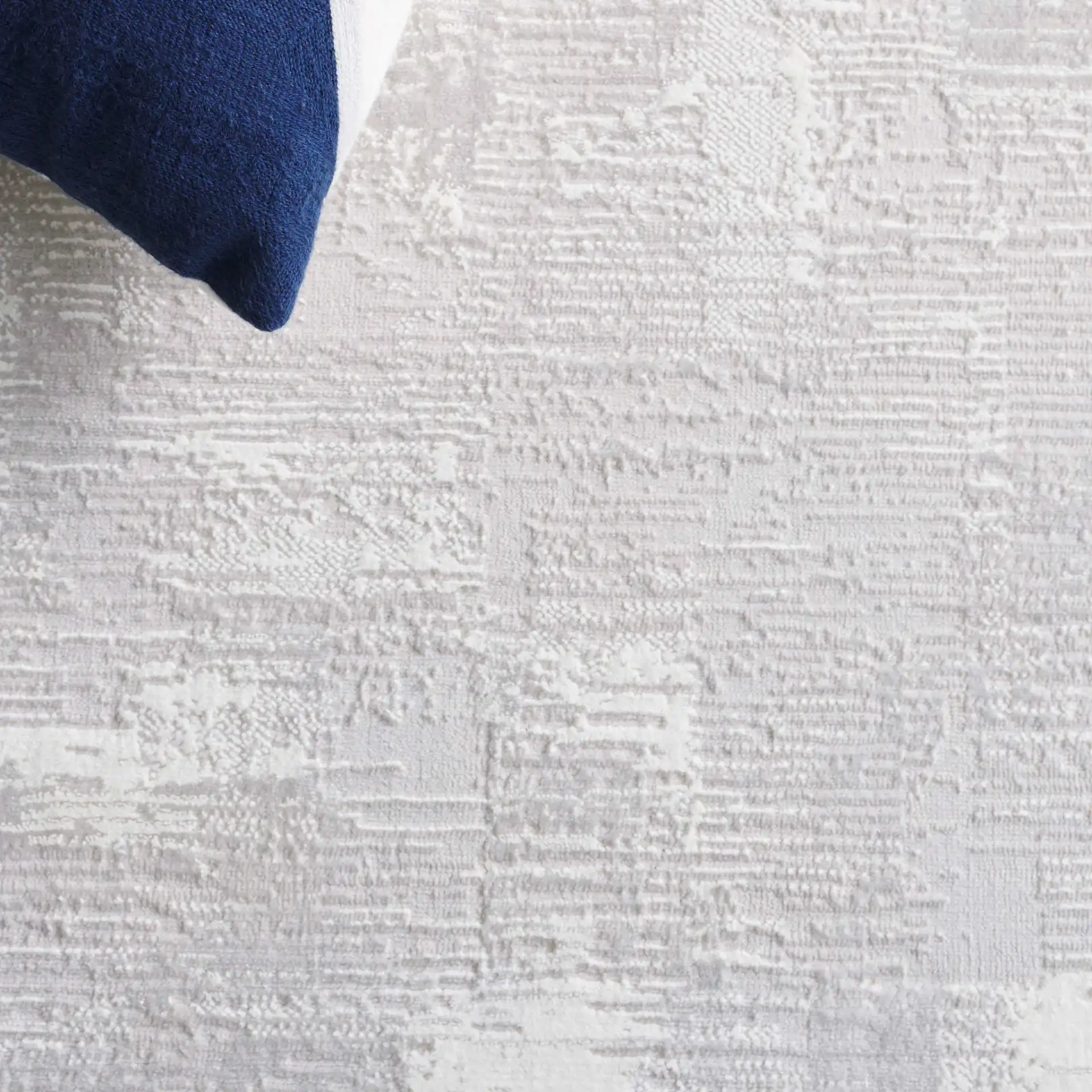 Memphis Distressed Abstract Rug in Gray / Ivory in a styled room