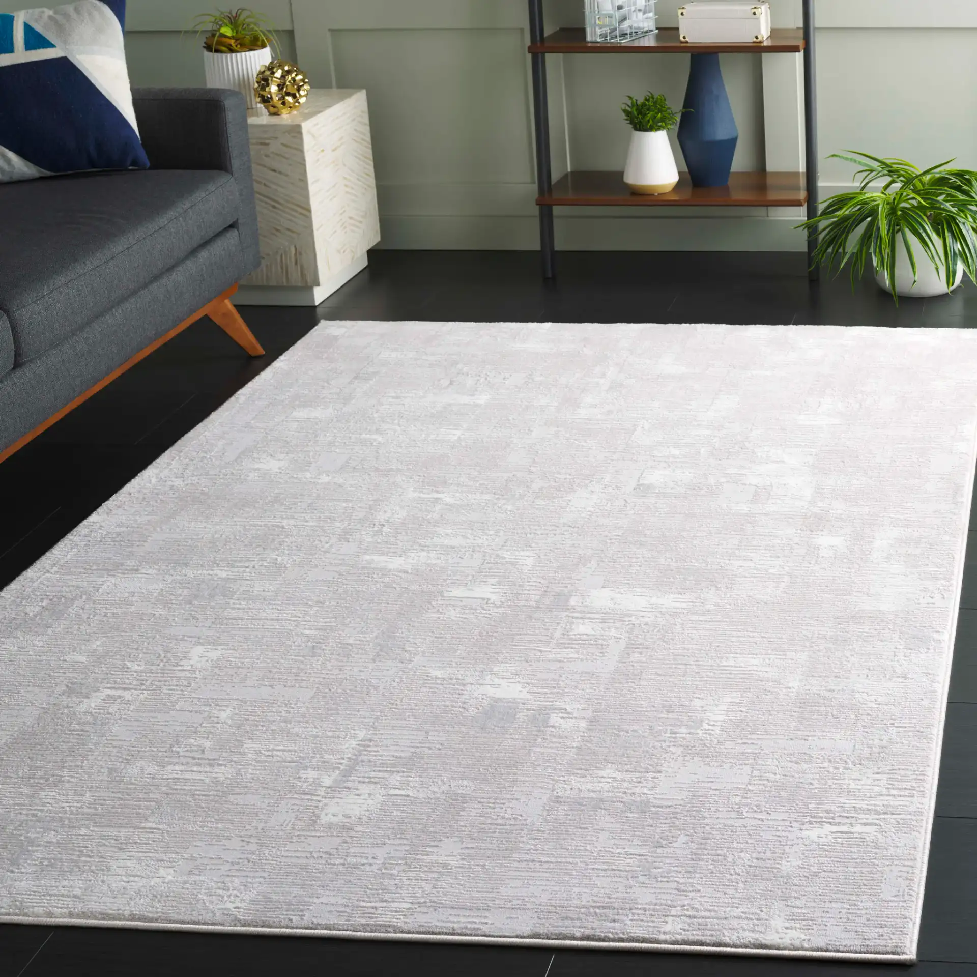 Memphis Distressed Abstract Rug in Gray / Ivory in a styled room