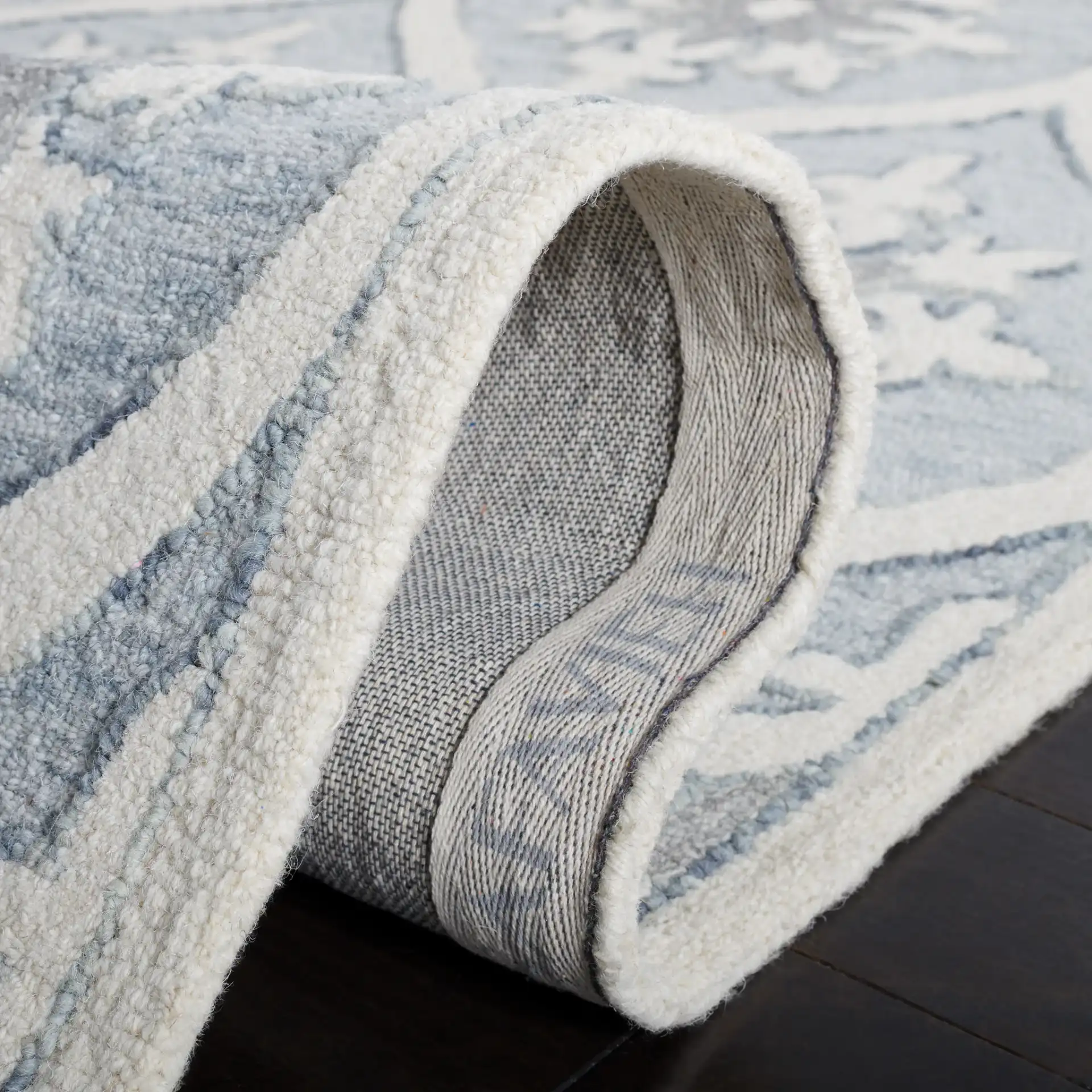 Metro Ogee Medallion Hand-Tufted Wool Rug in Gray / Ivory in a styled room
