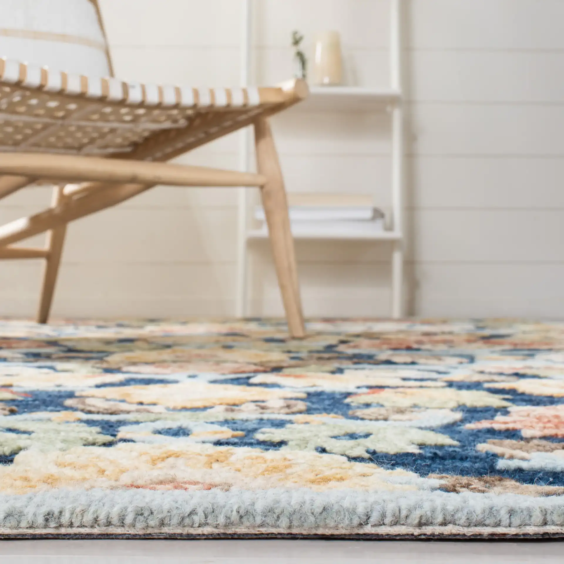 Metro Allover Floral Hand-Tufted Wool Rug in Blue / Orange in a styled room