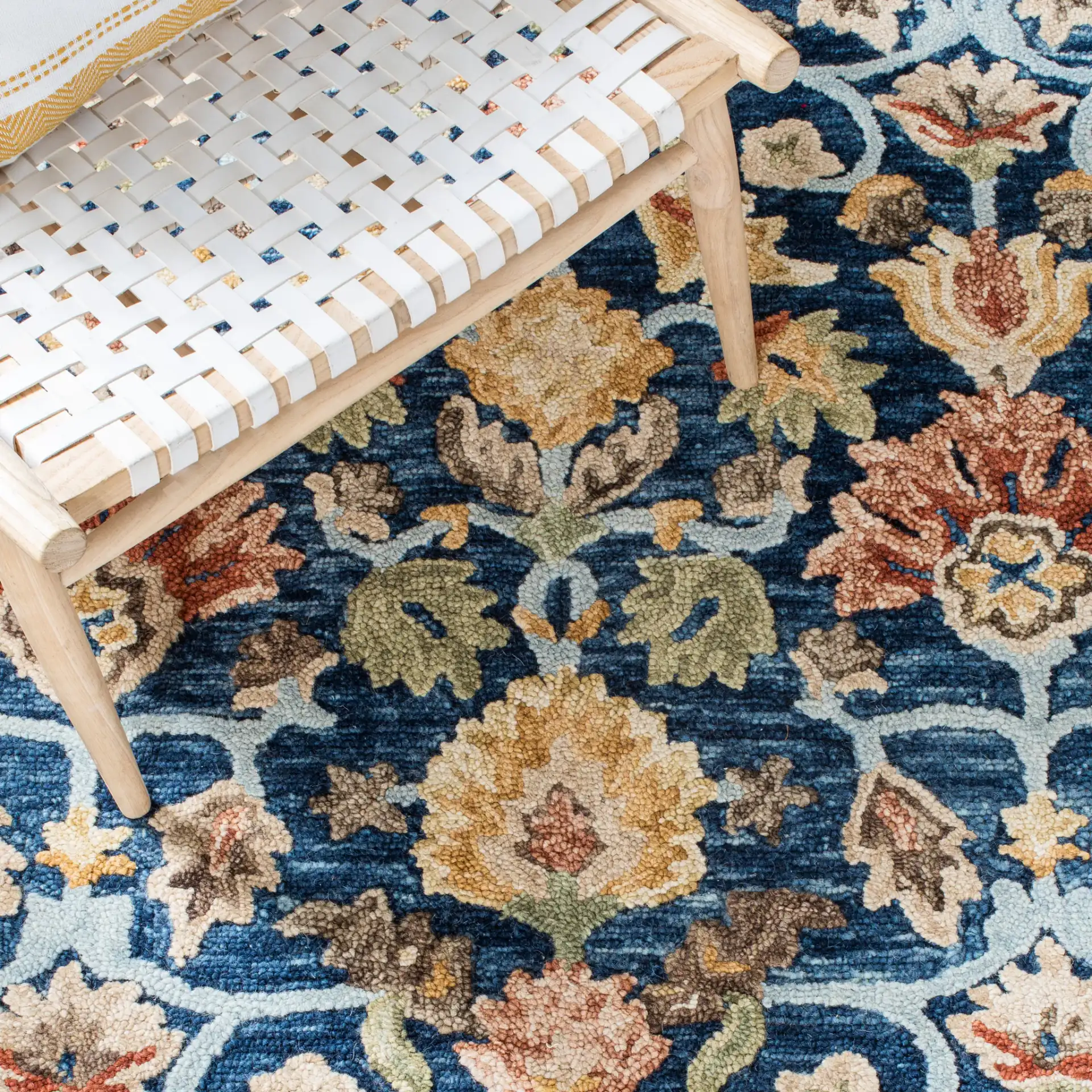 Metro Allover Floral Hand-Tufted Wool Rug in Blue / Orange in a styled room