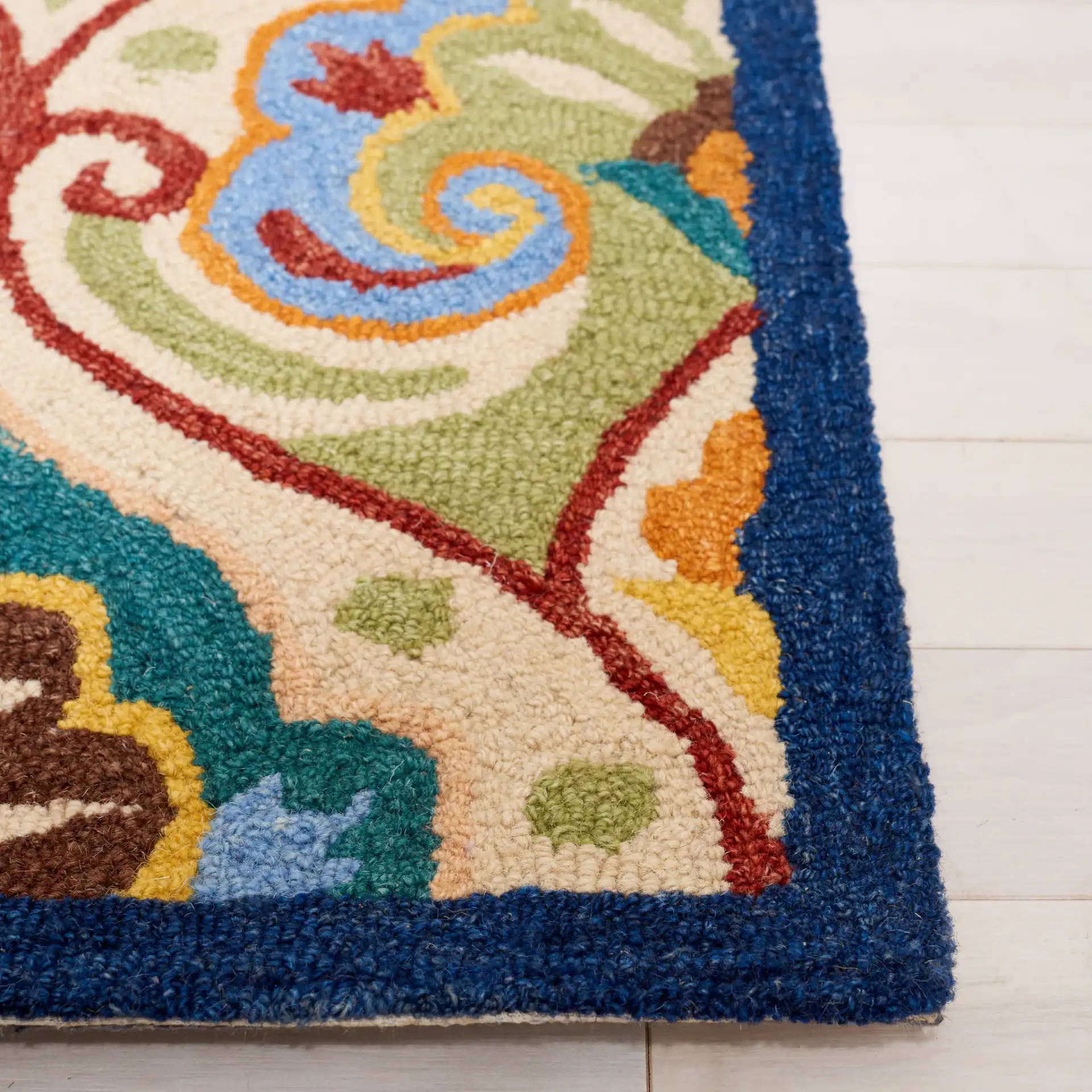 Metro Damask Scroll Trellis Hand-Tufted Wool Rug in Beige / Blue in a styled room