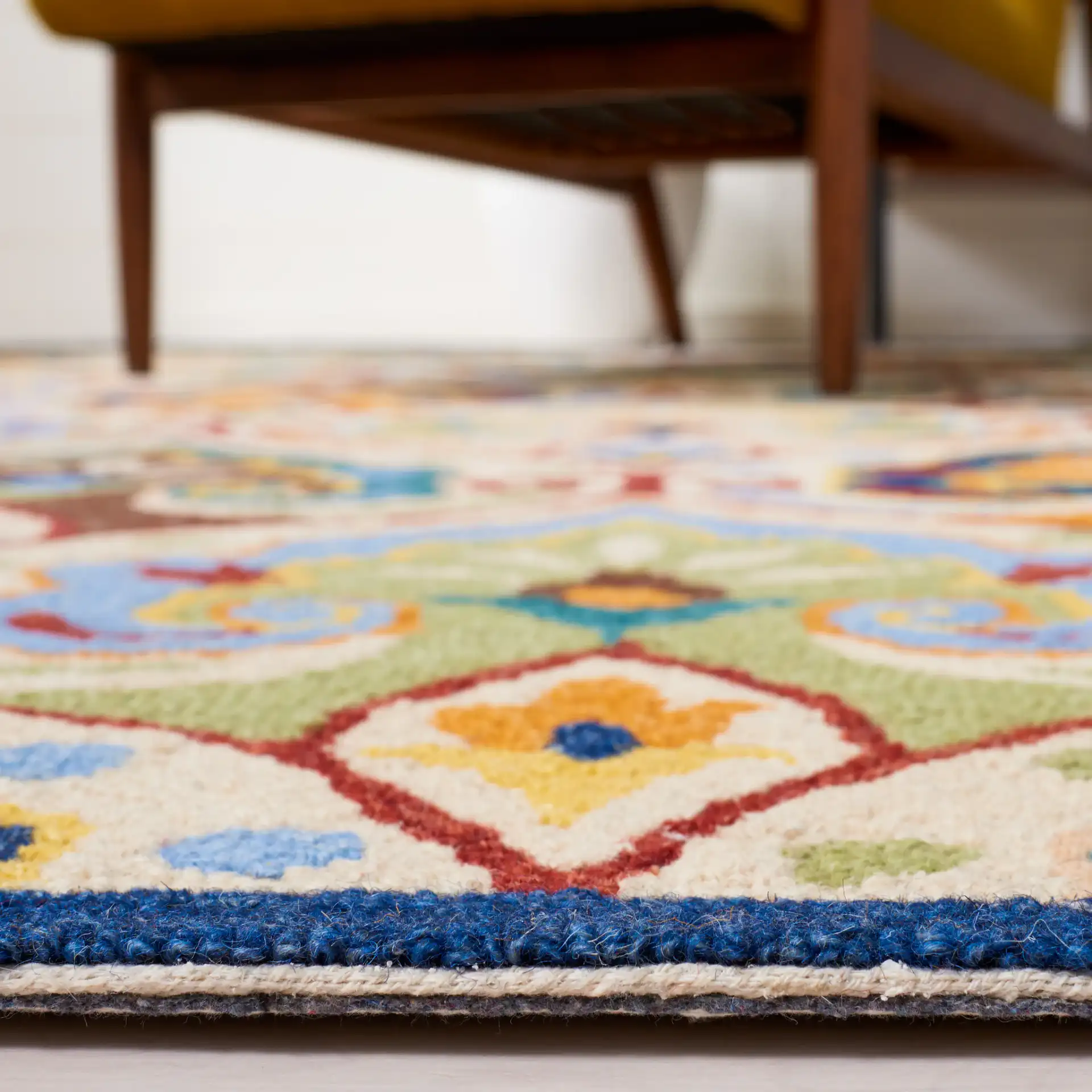 Metro Damask Scroll Trellis Hand-Tufted Wool Rug in Beige / Blue in a styled room