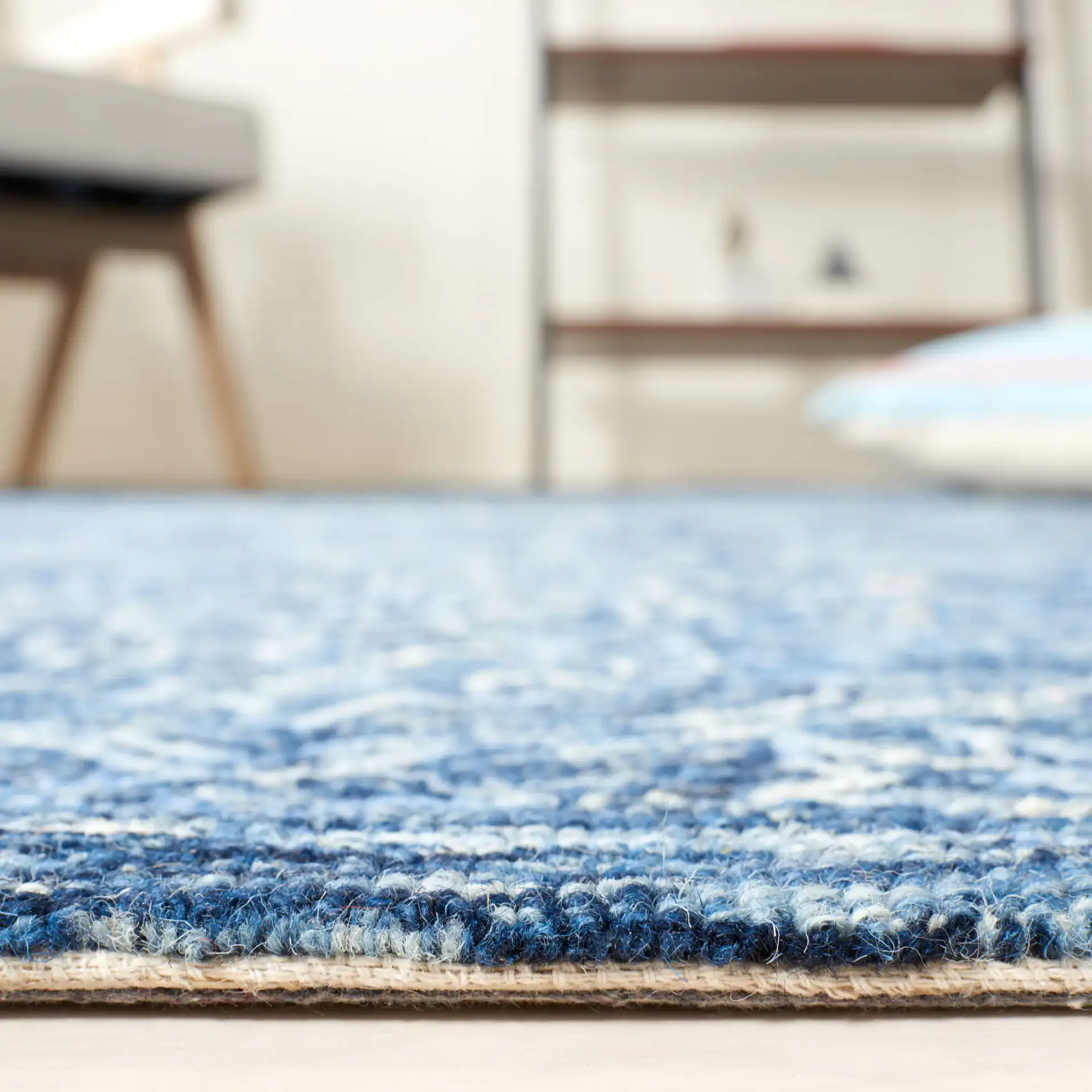 Metro Stepped Floral Medallion Hand-Tufted Wool Rug in Blue in a styled room