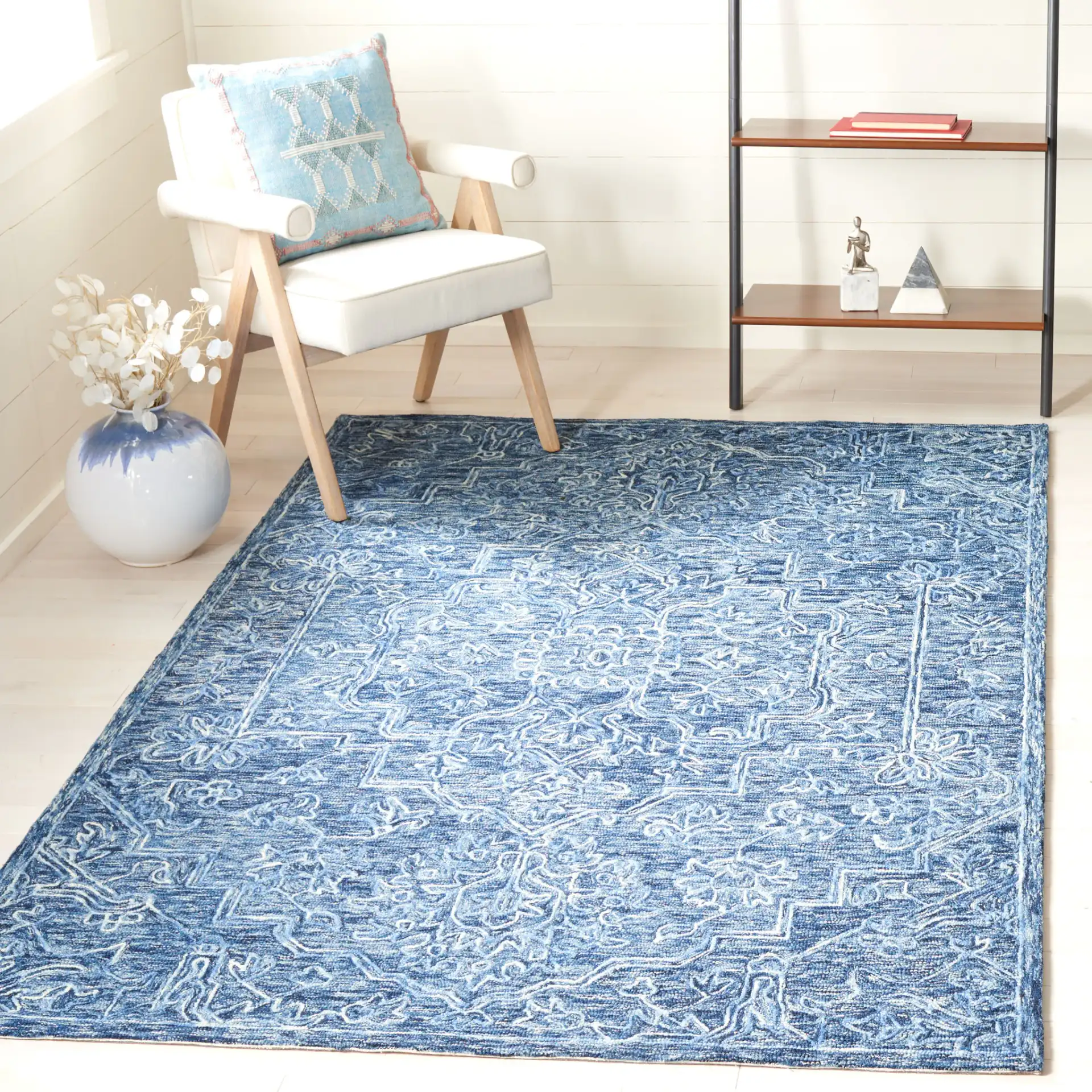 Metro Stepped Floral Medallion Hand-Tufted Wool Rug in Blue in a styled room