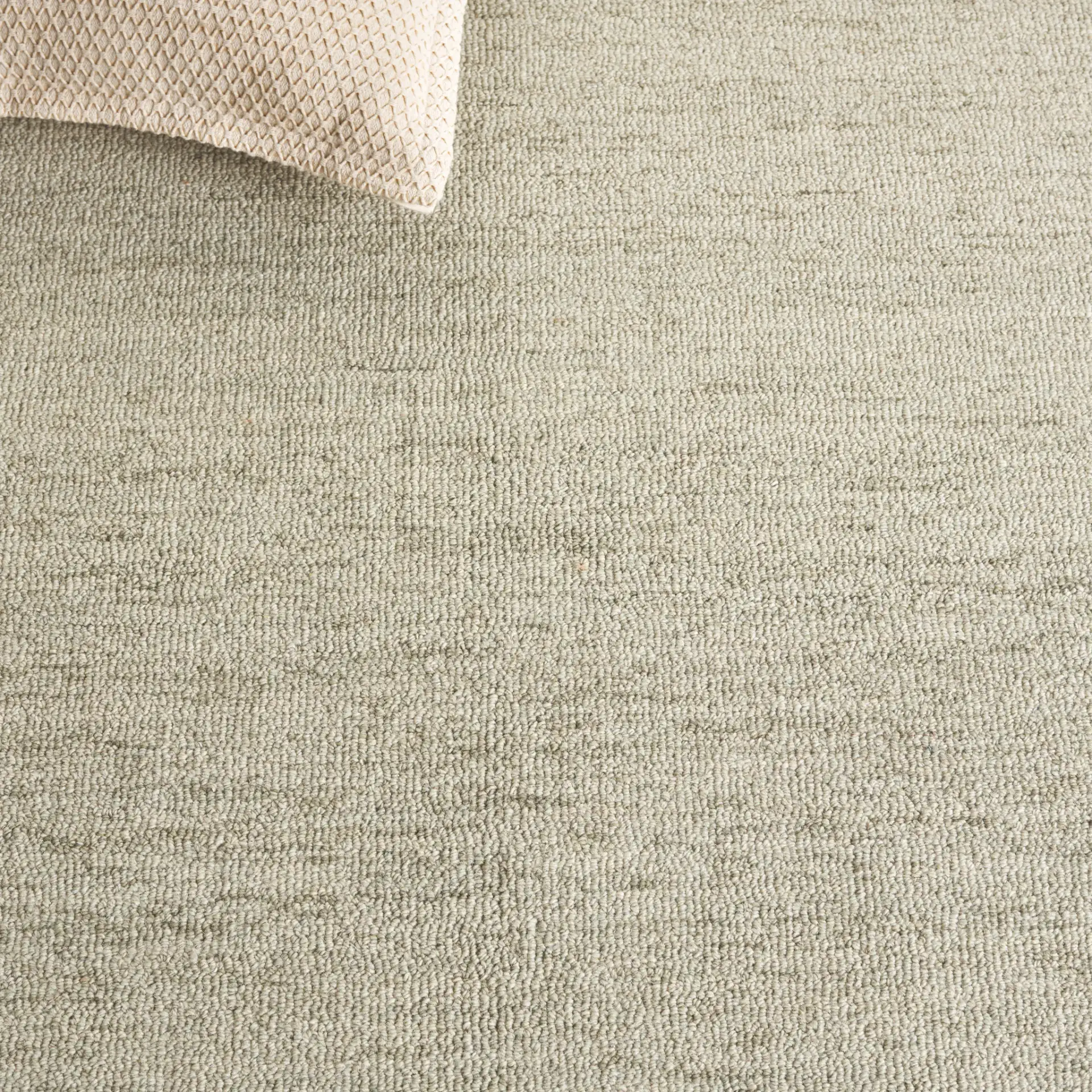Metro Modern Heathered Hand-Tufted Wool Rug in Green in a styled room