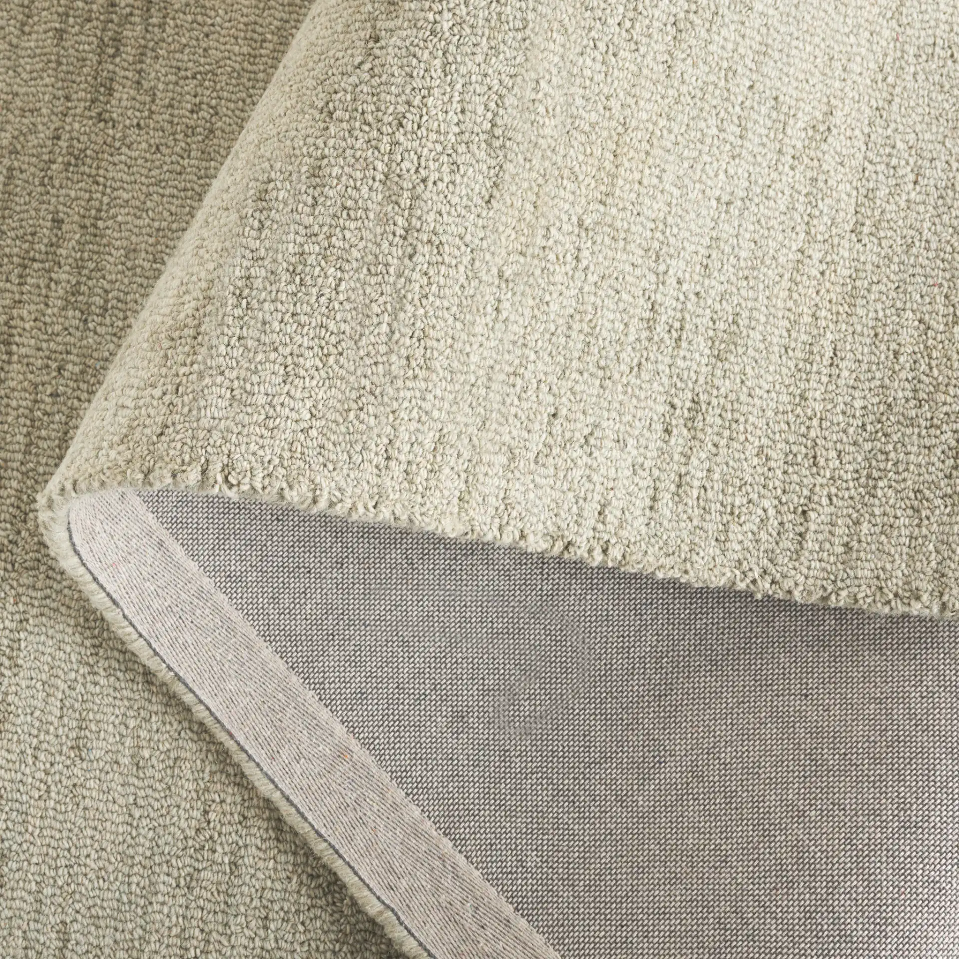 Metro Modern Heathered Hand-Tufted Wool Rug in Green in a styled room
