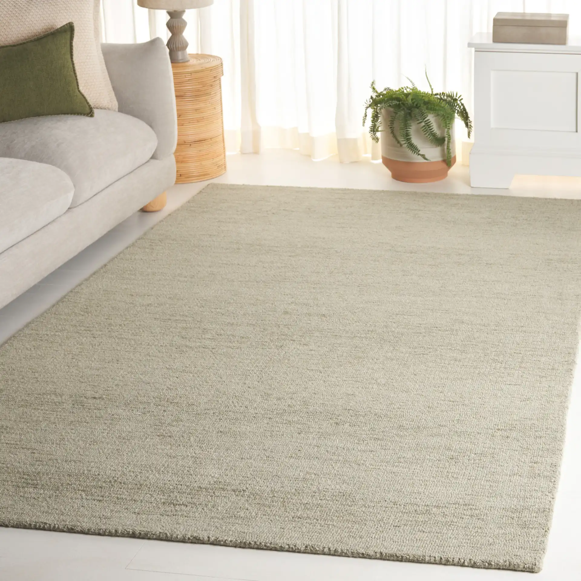 Metro Modern Heathered Hand-Tufted Wool Rug in Green in a styled room