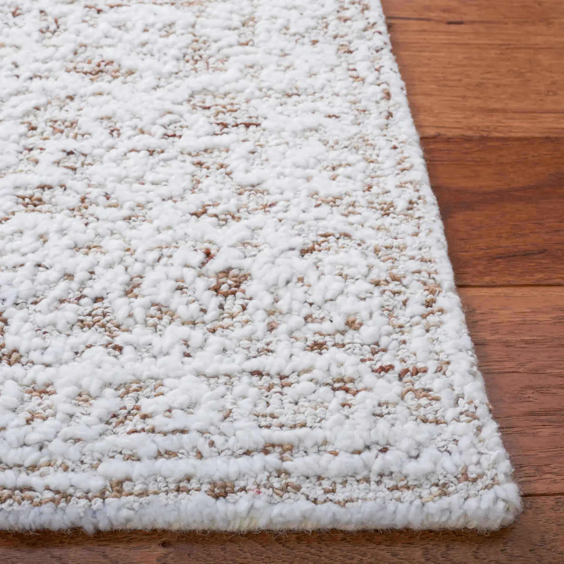 Metro Erased Medallion Hand-Tufted Wool Blend Rug in Ivory / Beige in a styled room