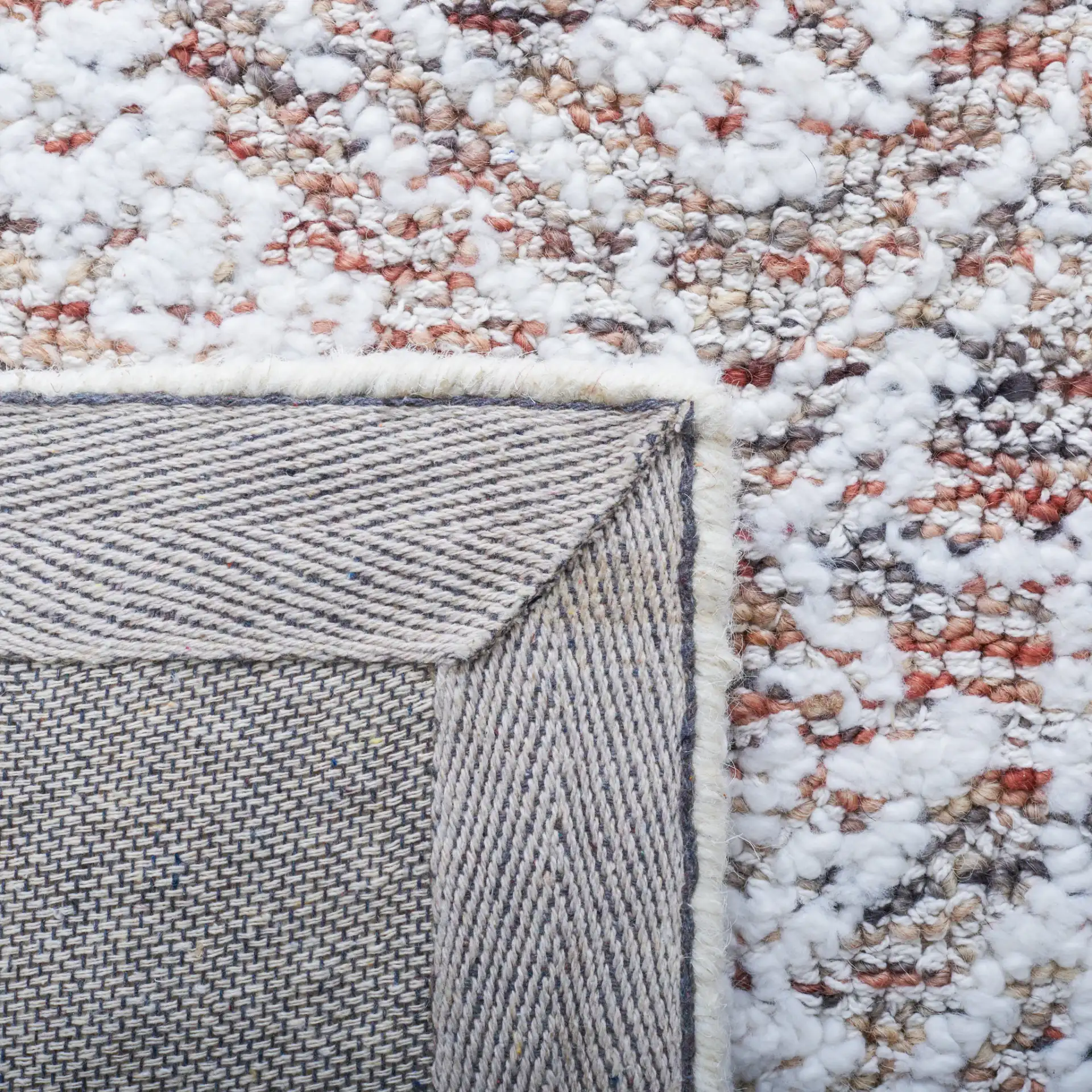 Metro Distressed Medallion Hand-Tufted Wool Blend Rug in Ivory / Rust in a styled room