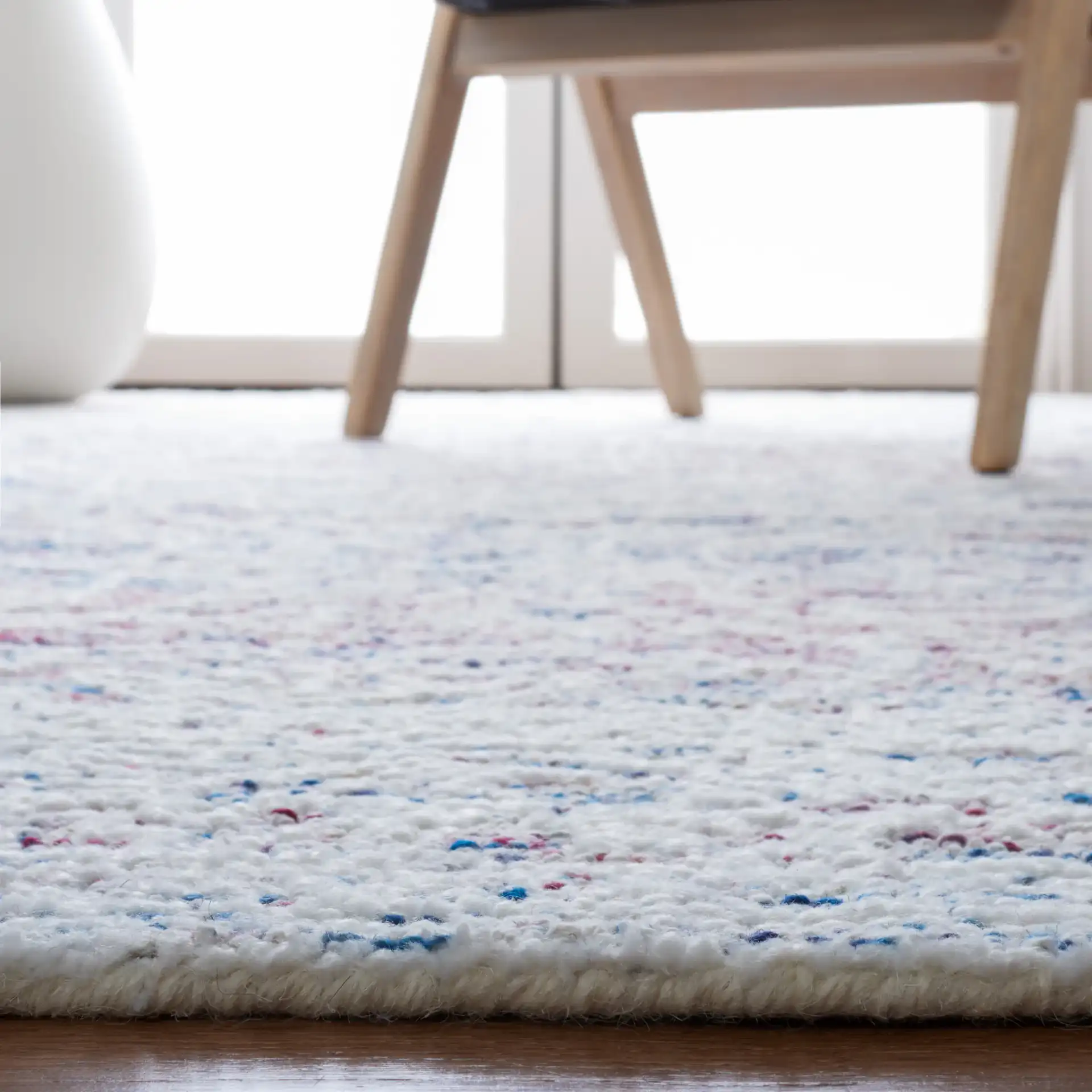 Metro Distressed Diamond Hand-Tufted Wool Blend Rug in Ivory / Red in a styled room