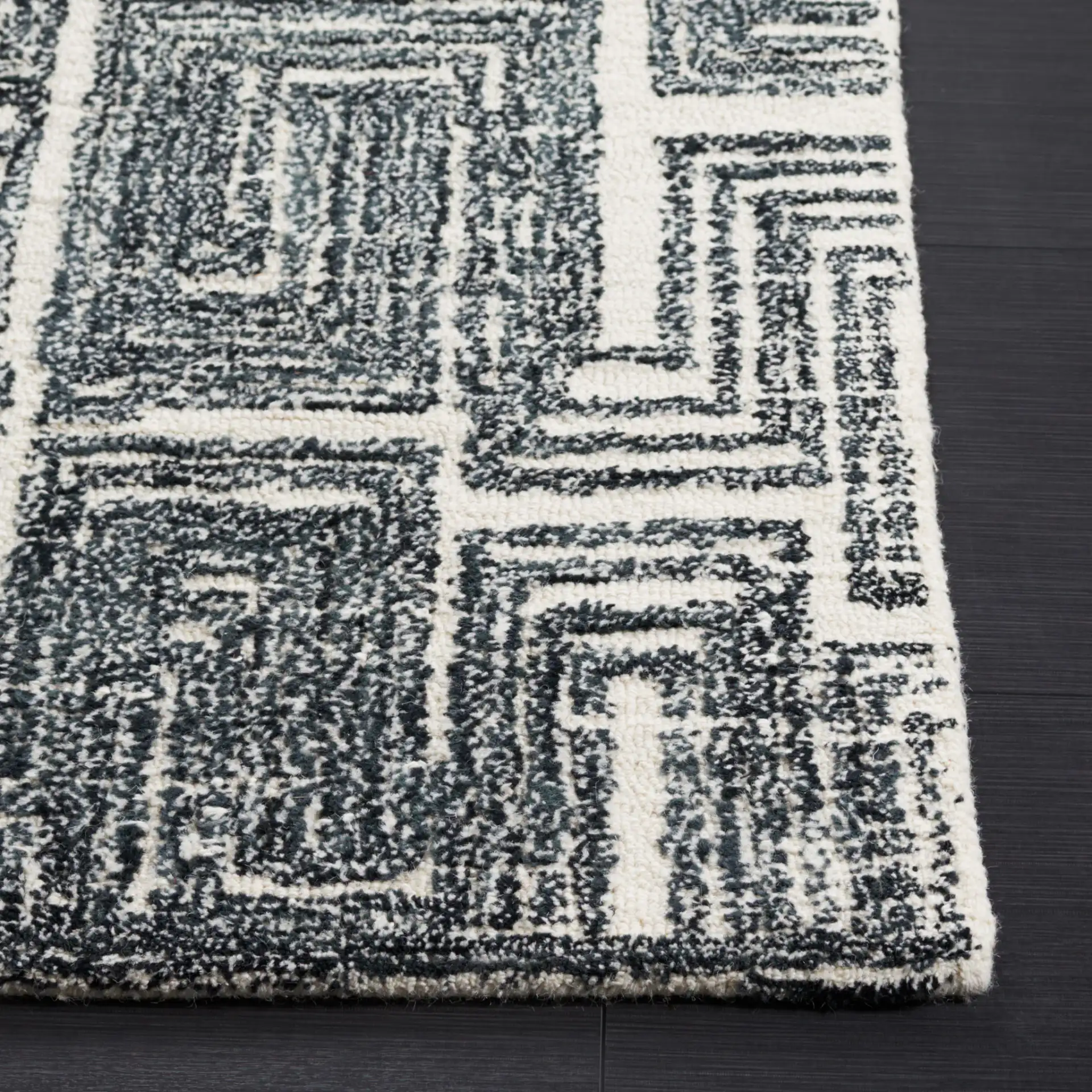 Metro Interlocking Block Hand-Tufted Wool Rug in Black / Ivory in a styled room