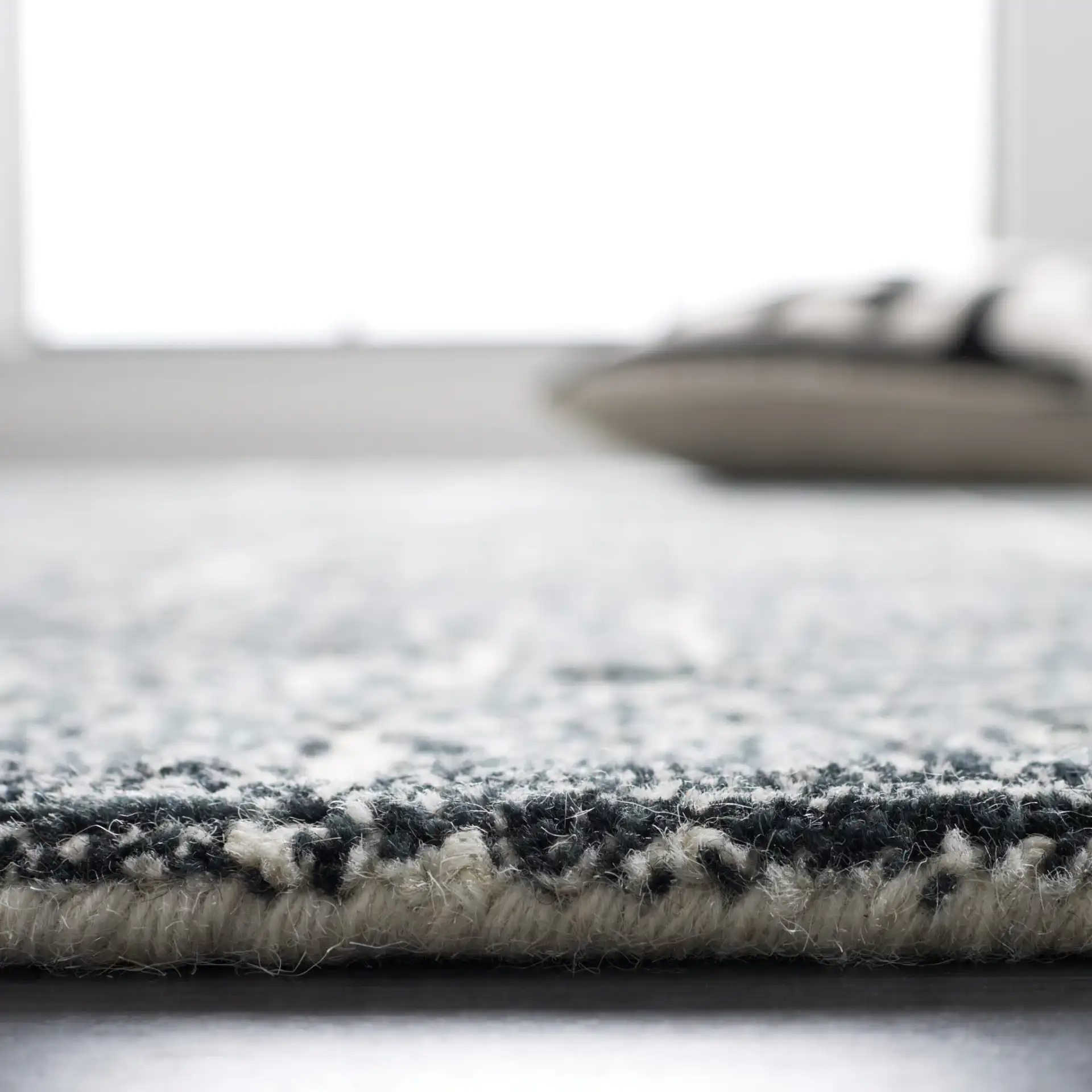 Metro Interlocking Block Hand-Tufted Wool Rug in Black / Ivory in a styled room