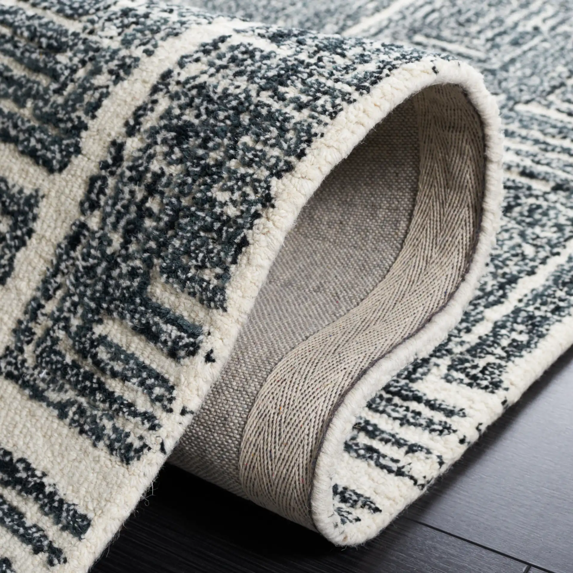 Metro Interlocking Block Hand-Tufted Wool Rug in Black / Ivory in a styled room